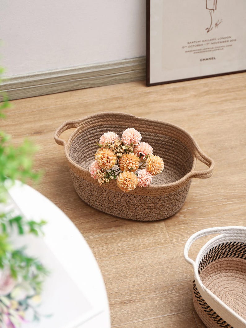 Cotton rope storage basket with handle: Handmade, suitable for nurseries and home dcor.