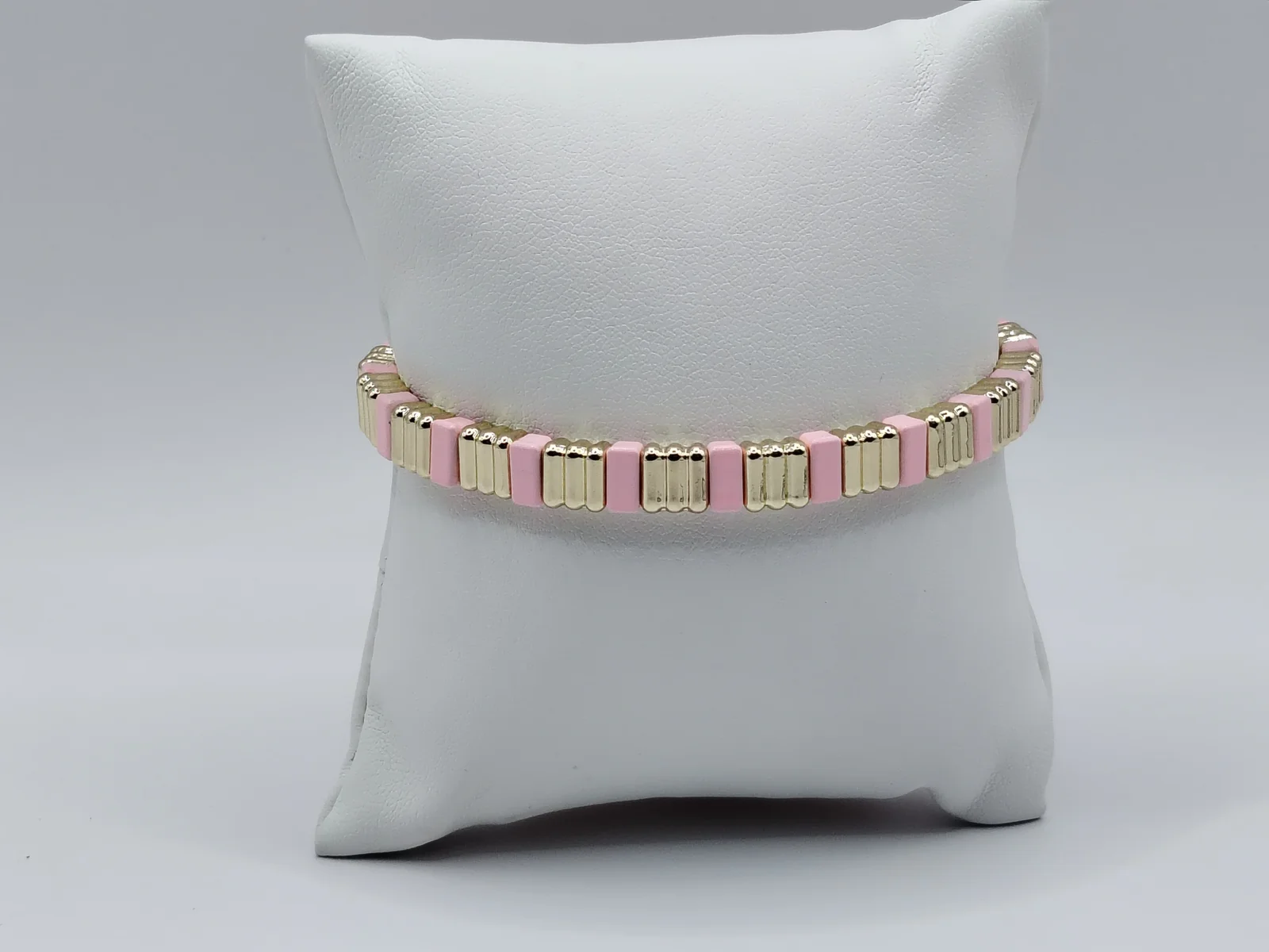 Pulsera elástica de acero y esmalte rosa