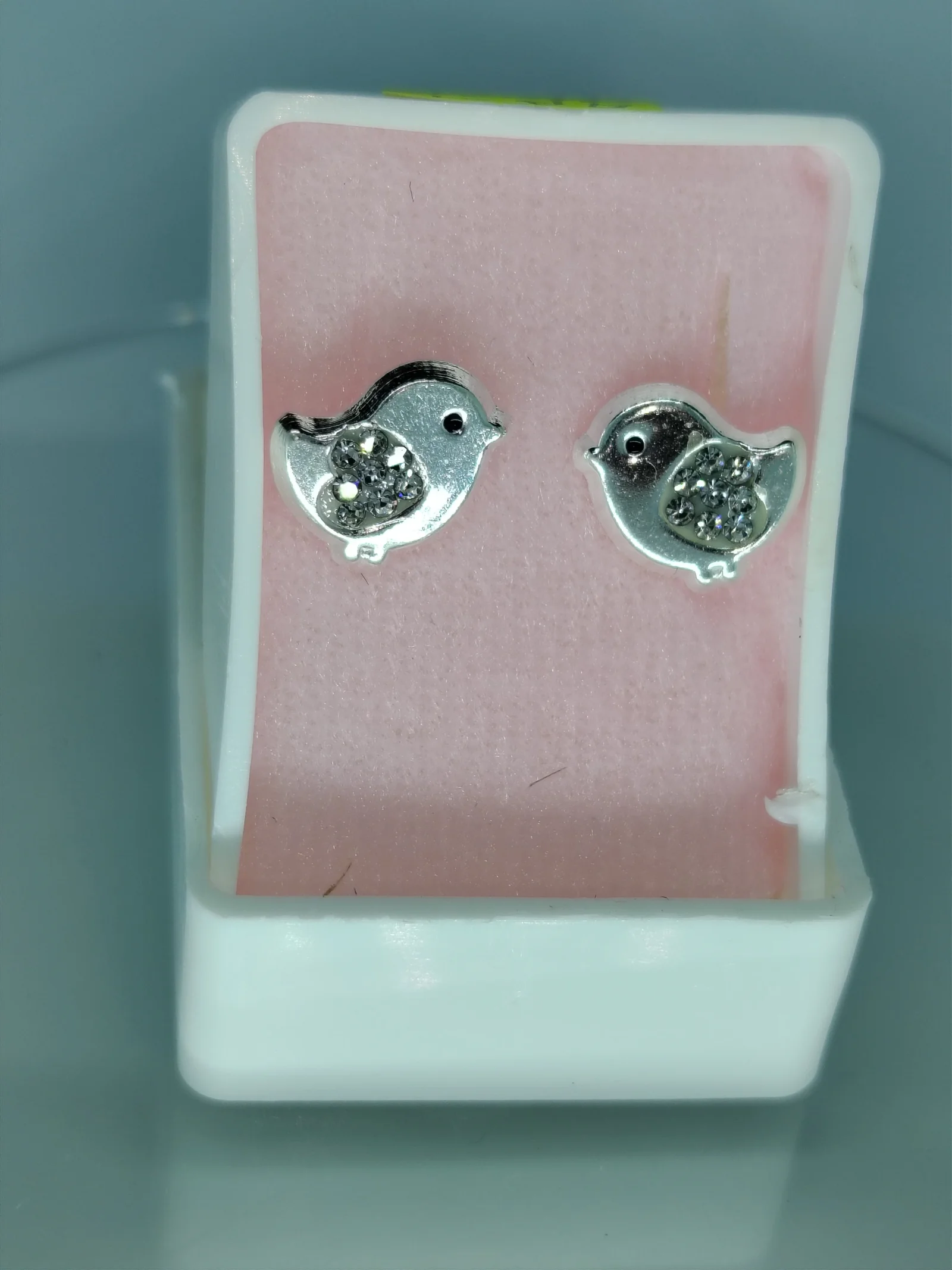 Aretes de pájaro plateados con zirconia