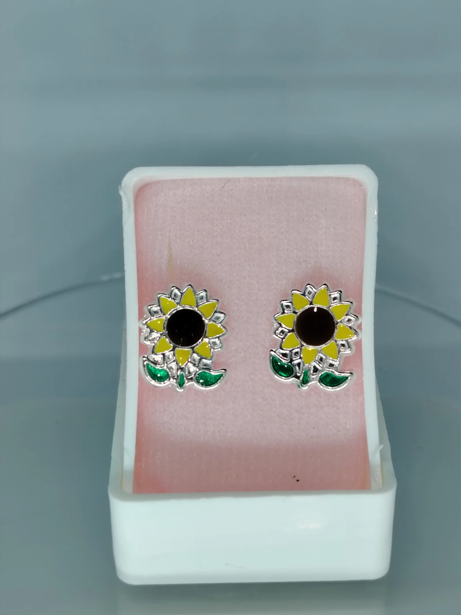 Broquel plata con bolita girasol encapsulado