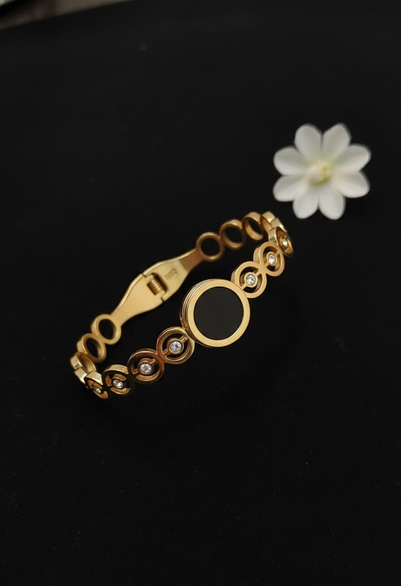 Gold-Toned Circle Cutout Cuff Bracelet with Black Enamel Center