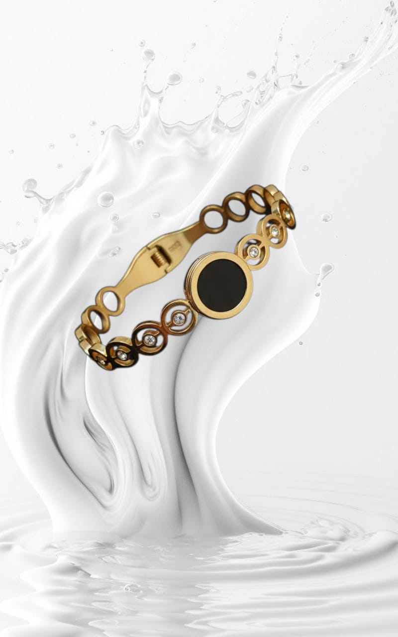 Gold-Toned Circle Cutout Cuff Bracelet with Black Enamel Center