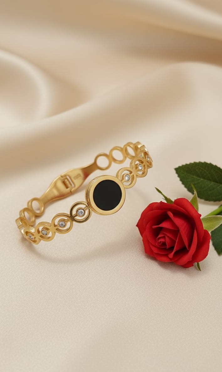 Gold-Toned Circle Cutout Cuff Bracelet with Black Enamel Center