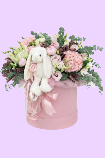 Caja de flores con peluche