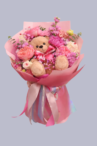 Ramo de flores con oso de peluche