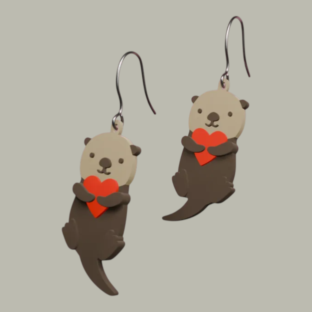 Aretes nutria con corazón