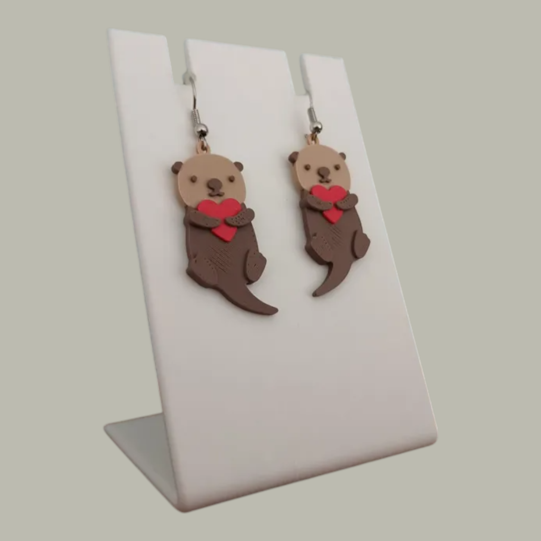 Aretes nutria con corazón