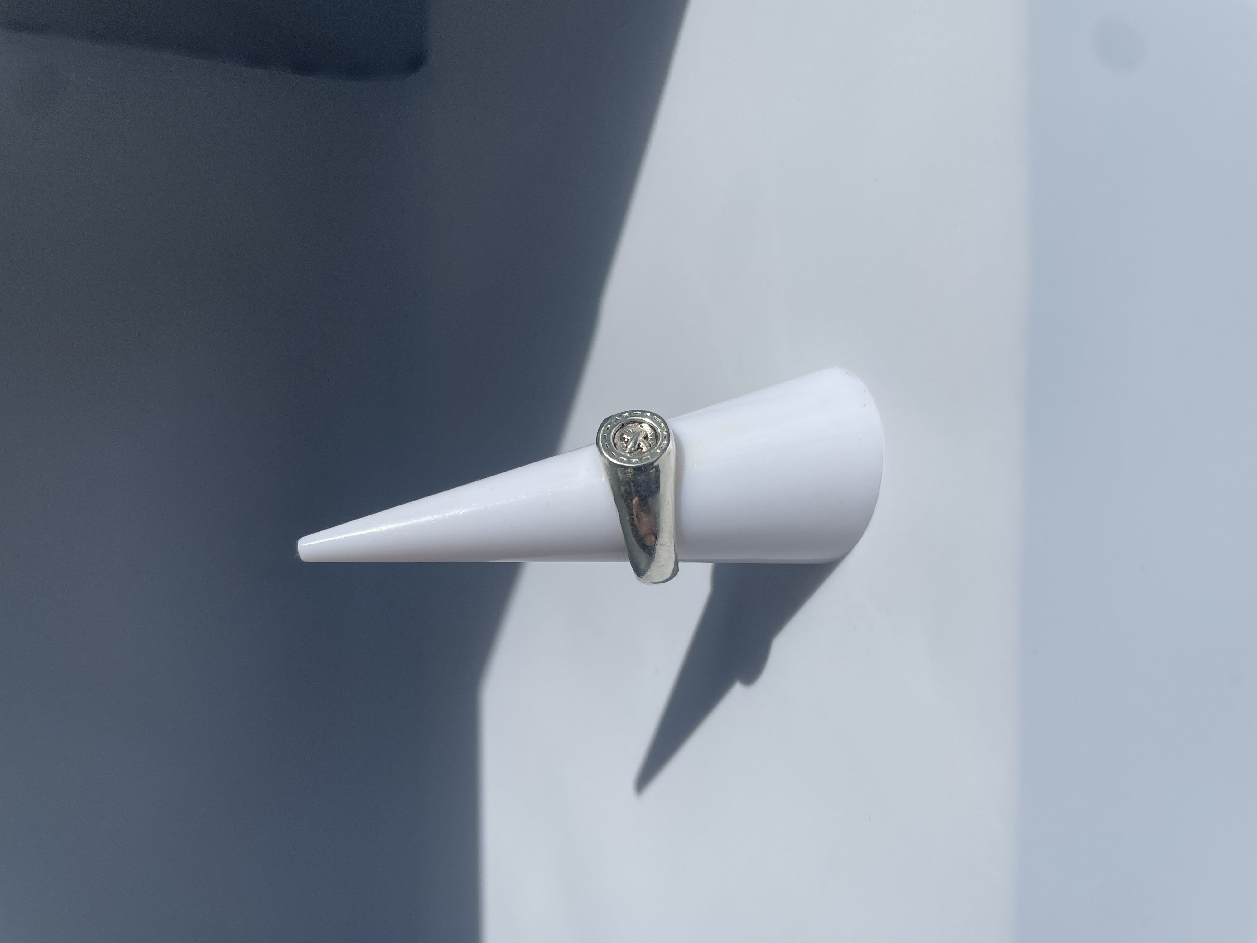 Stitched button ring 