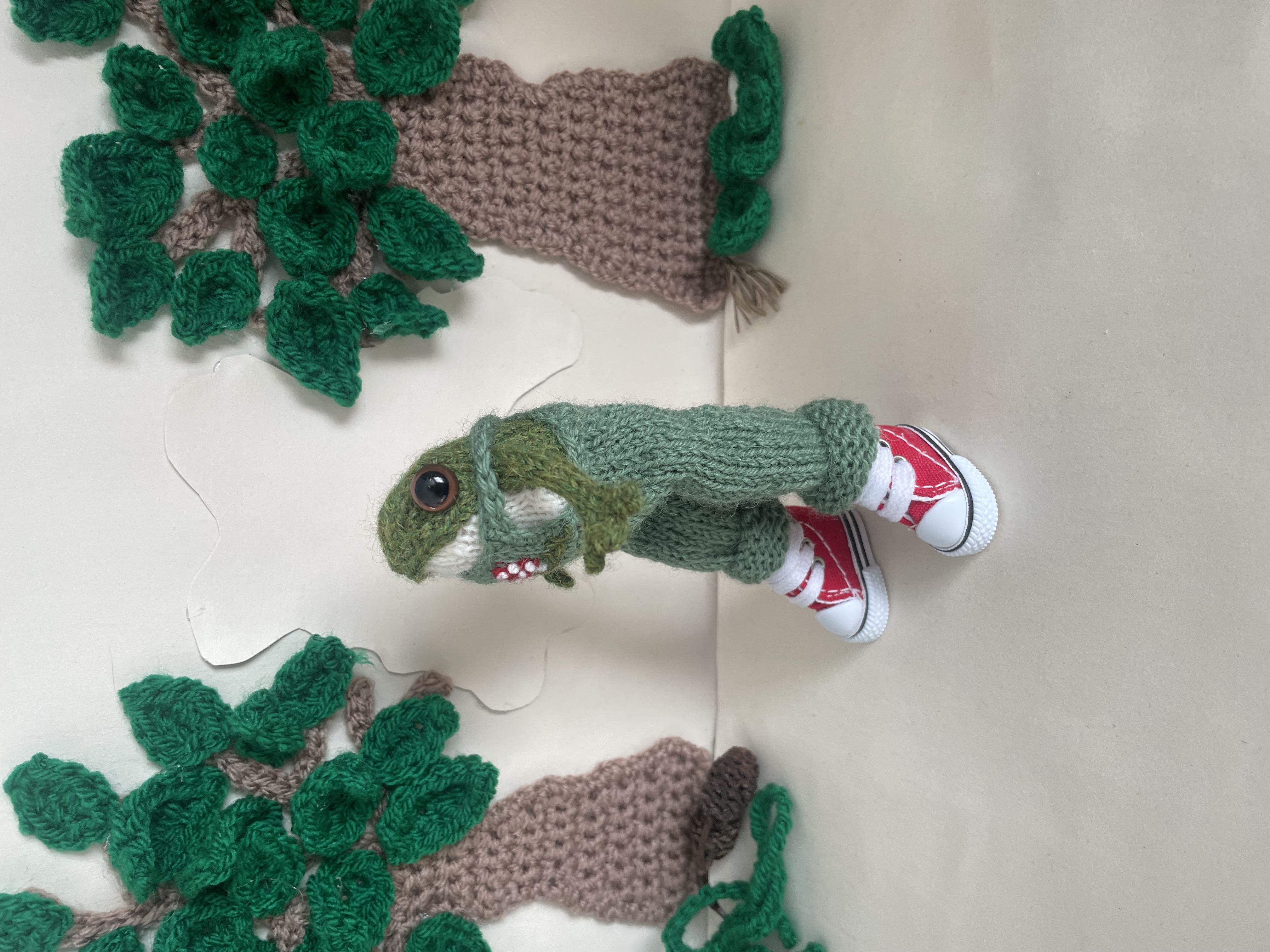 Timmy the knitted Frog in his dungarees 