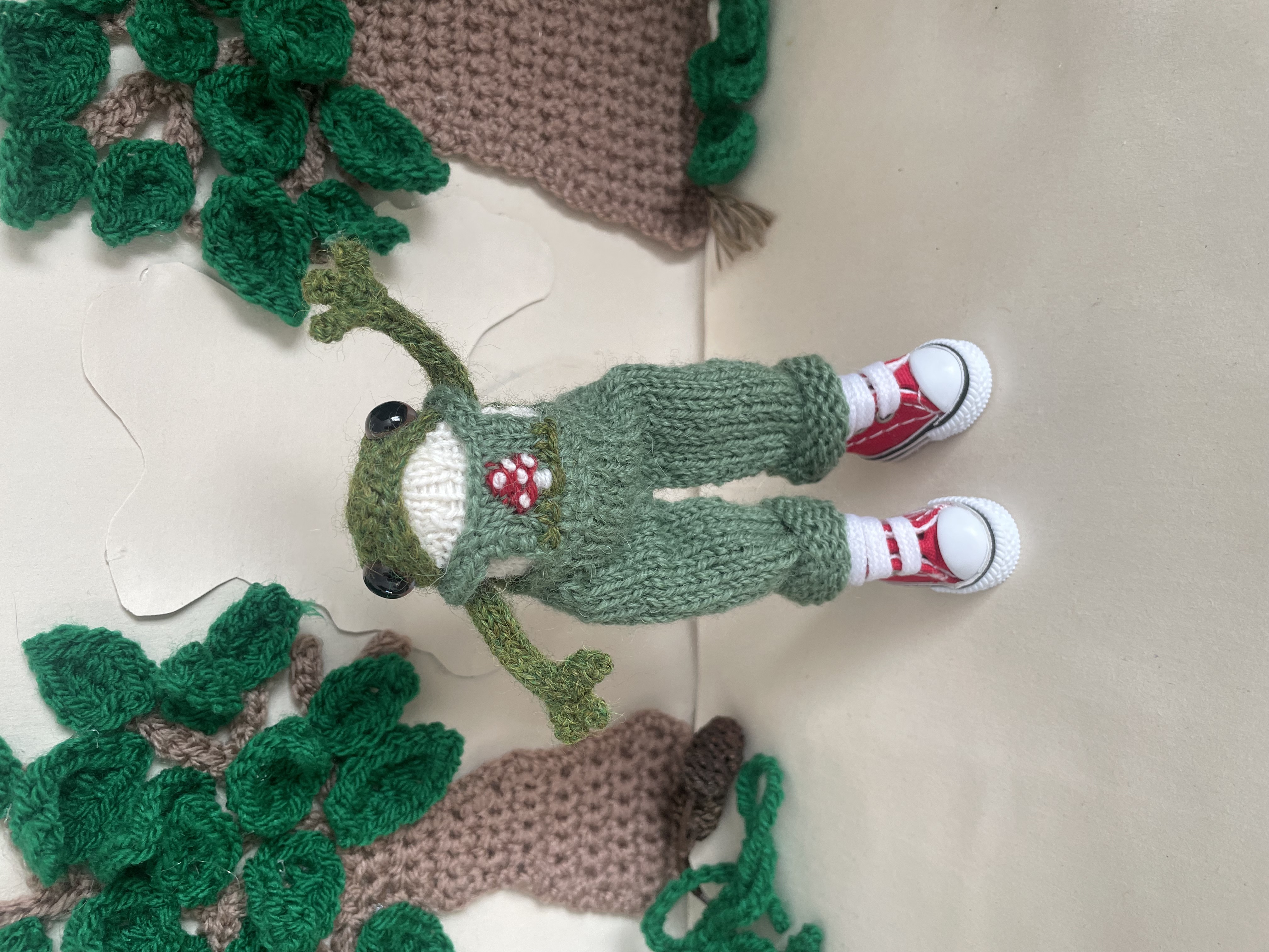 Timmy the knitted Frog in his dungarees 