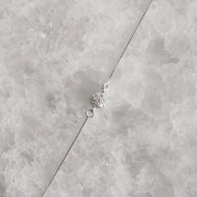 Pulseira entremeio botão cravejado