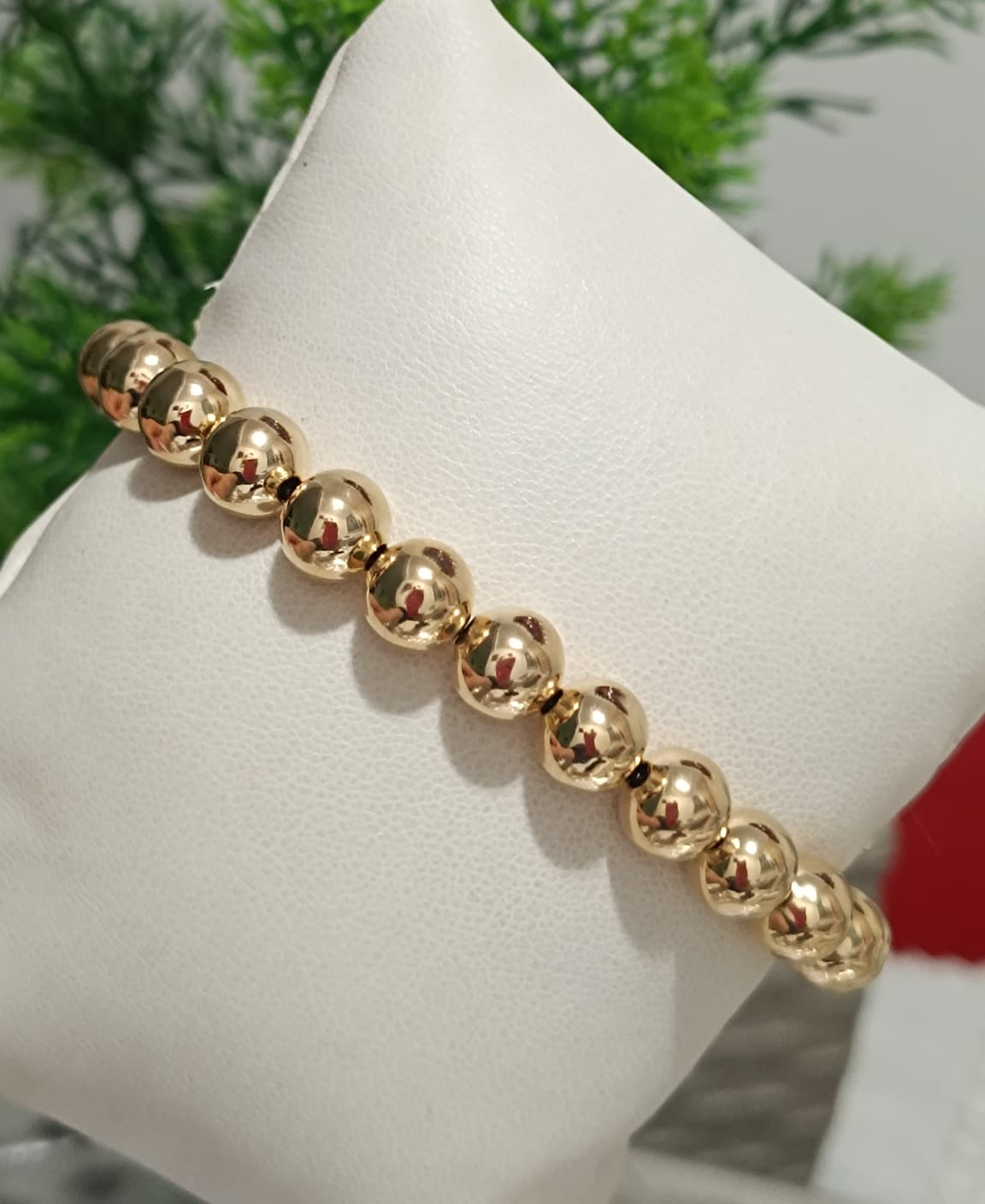 Pulseira de Bolas Douradas