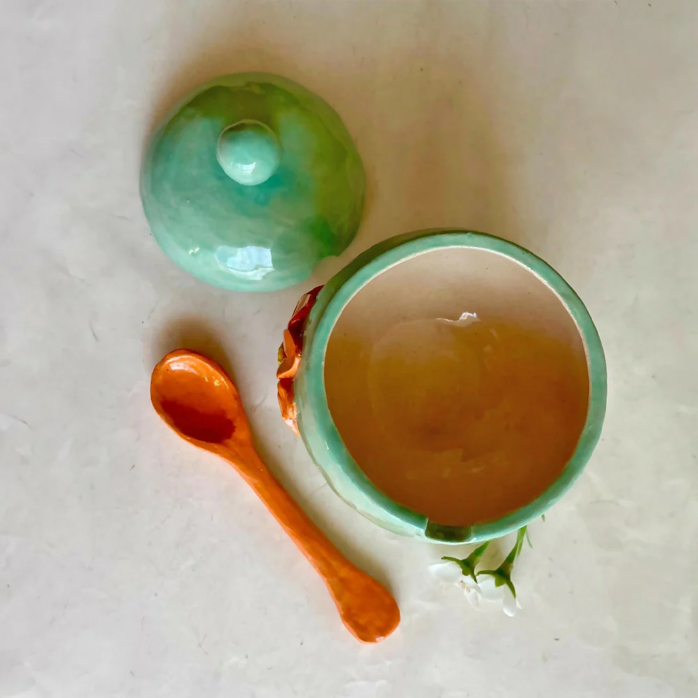 Coil and pinch handmade marigold flower bowl with spoon