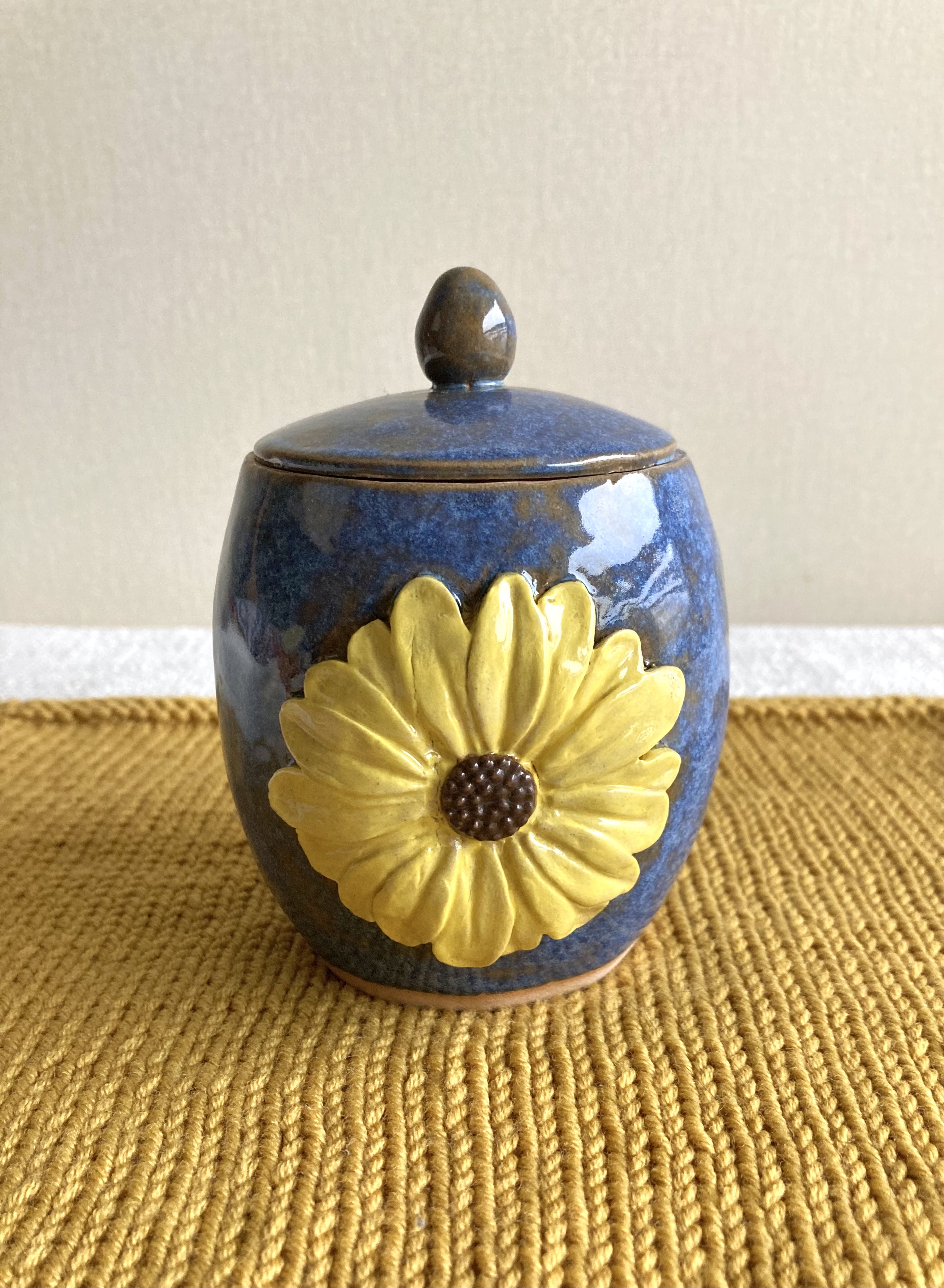 Handmade coil and pinch sunflower garlic pot