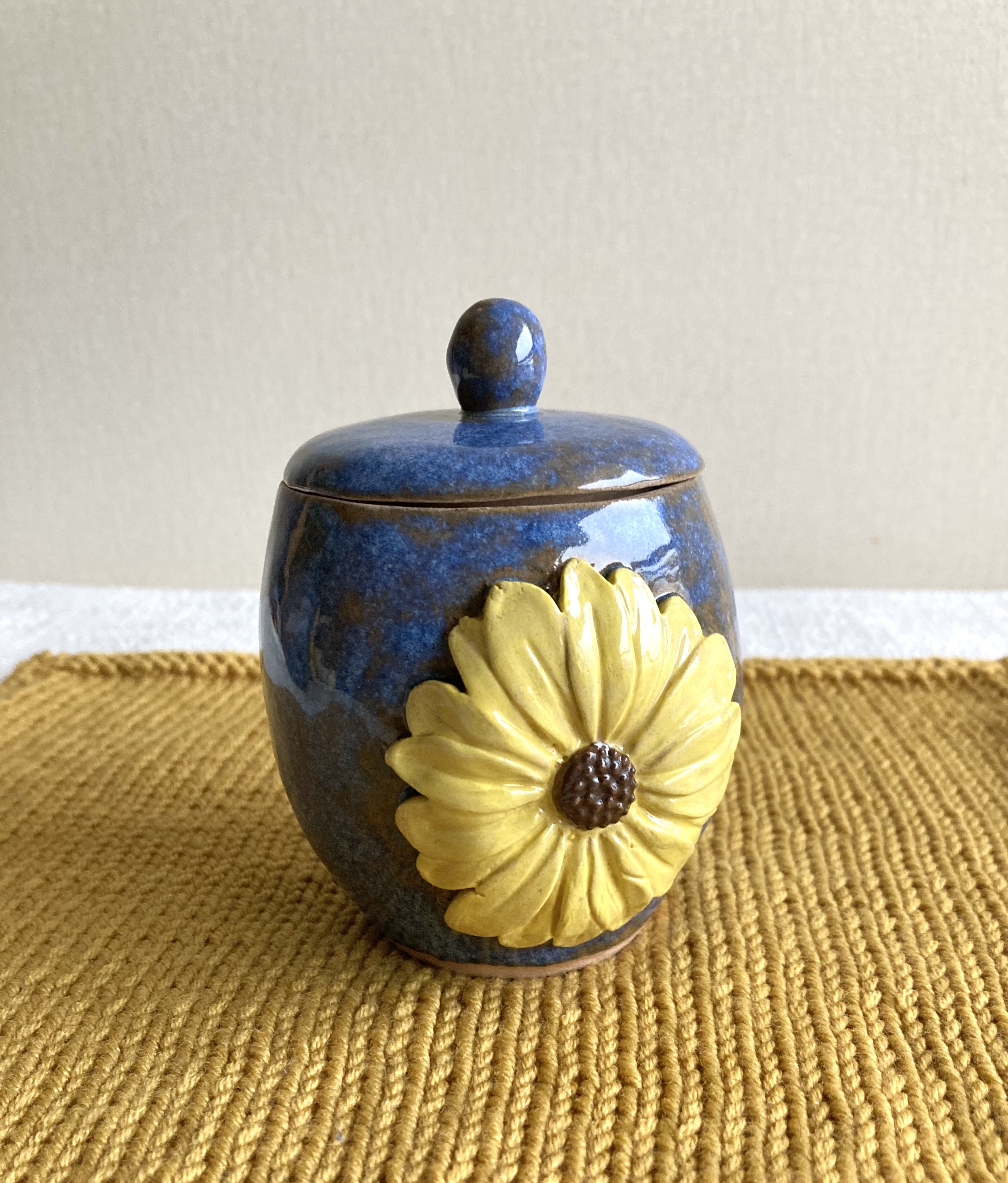 Small coil and pinch handmade sunflower garlic pot