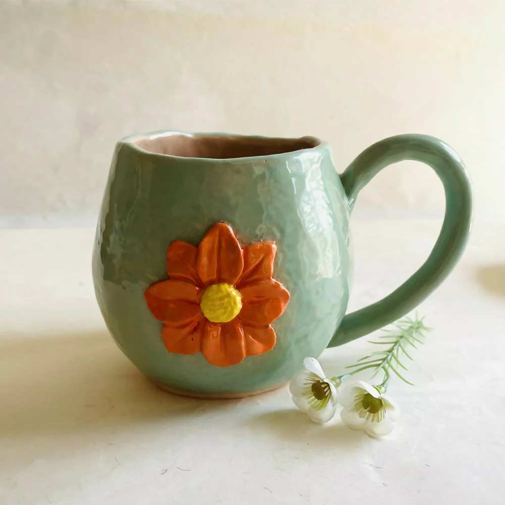 Coil and pinch handmade marigold flower cup