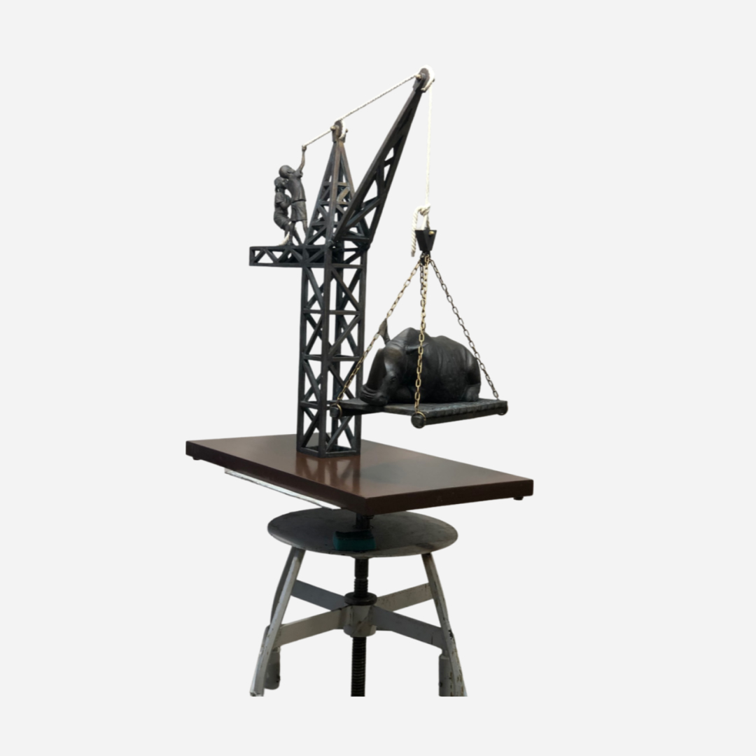 Children pull a rhino