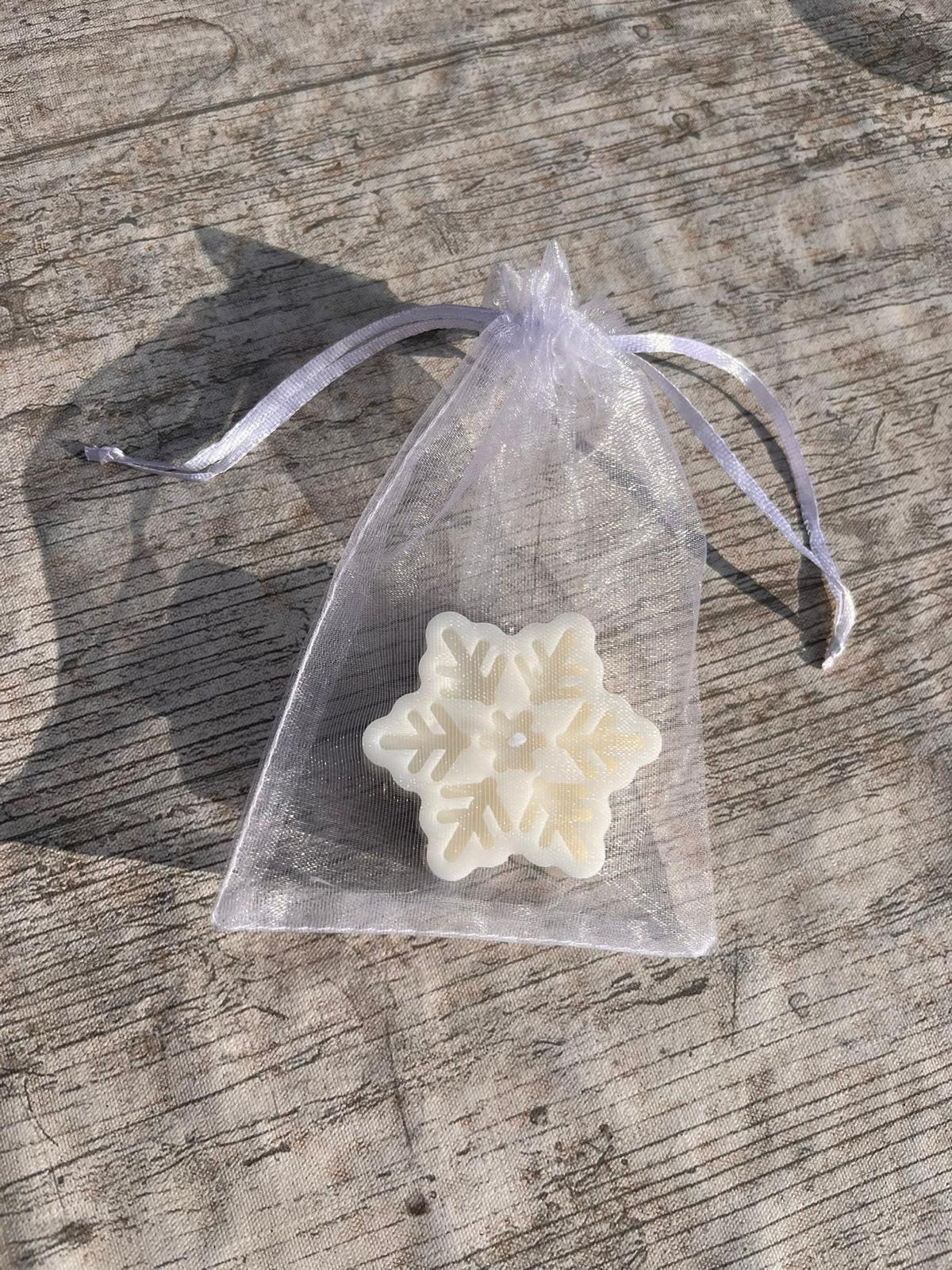 Vela en forma de copo de nieve