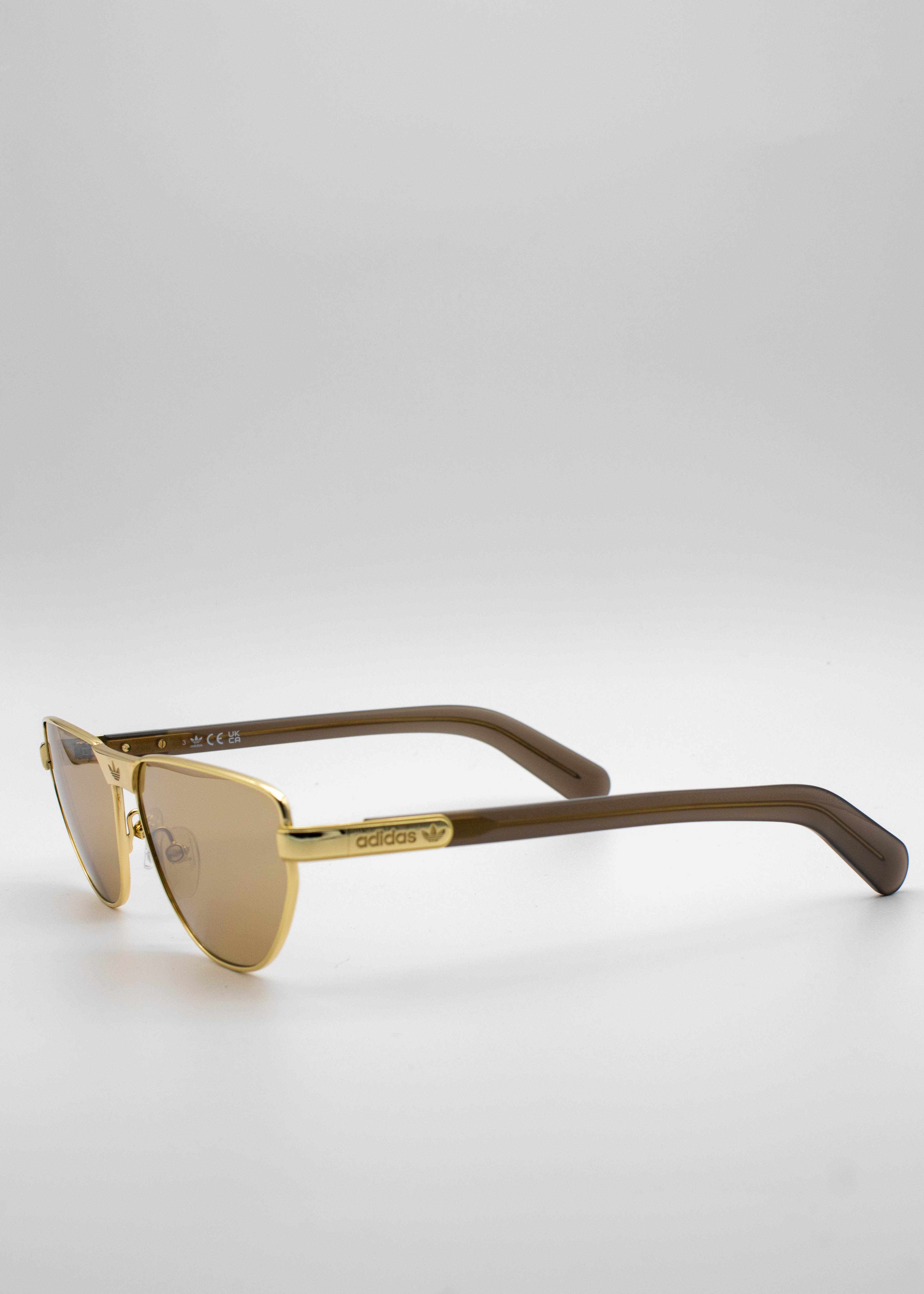 Adidas: Lentes de Sol Dorados