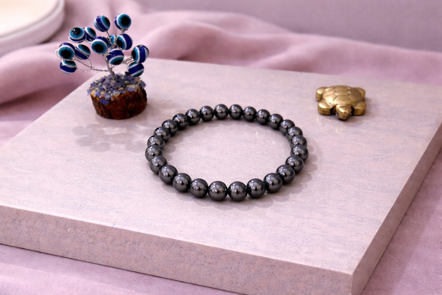 Hematite Grounding Bracelet with Evil Eye Plant & Pyrite Tortoise | Certificate of Authenticity of Bracelet also included |