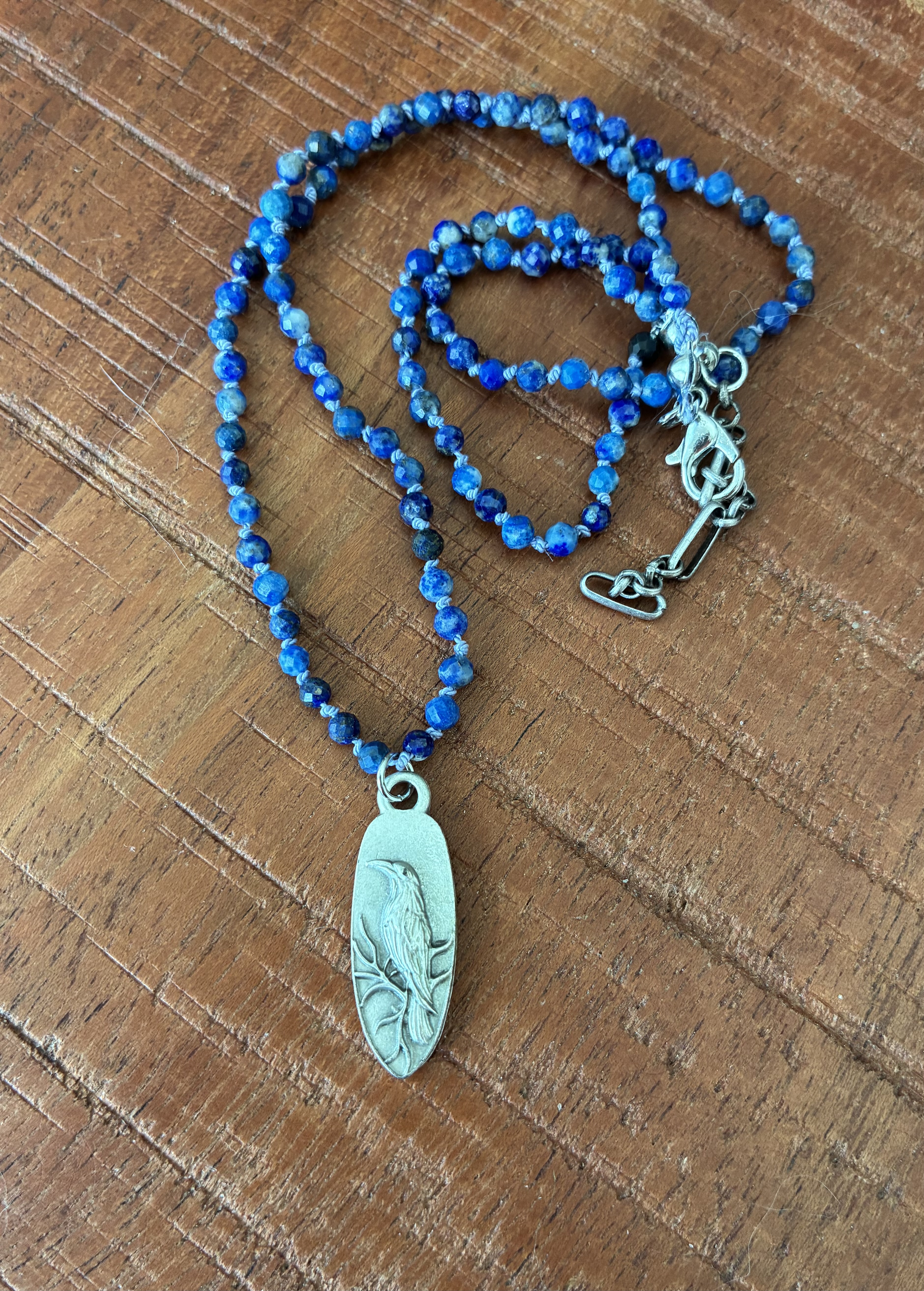 Delicate Blue Stone Necklace with Raven Pendant