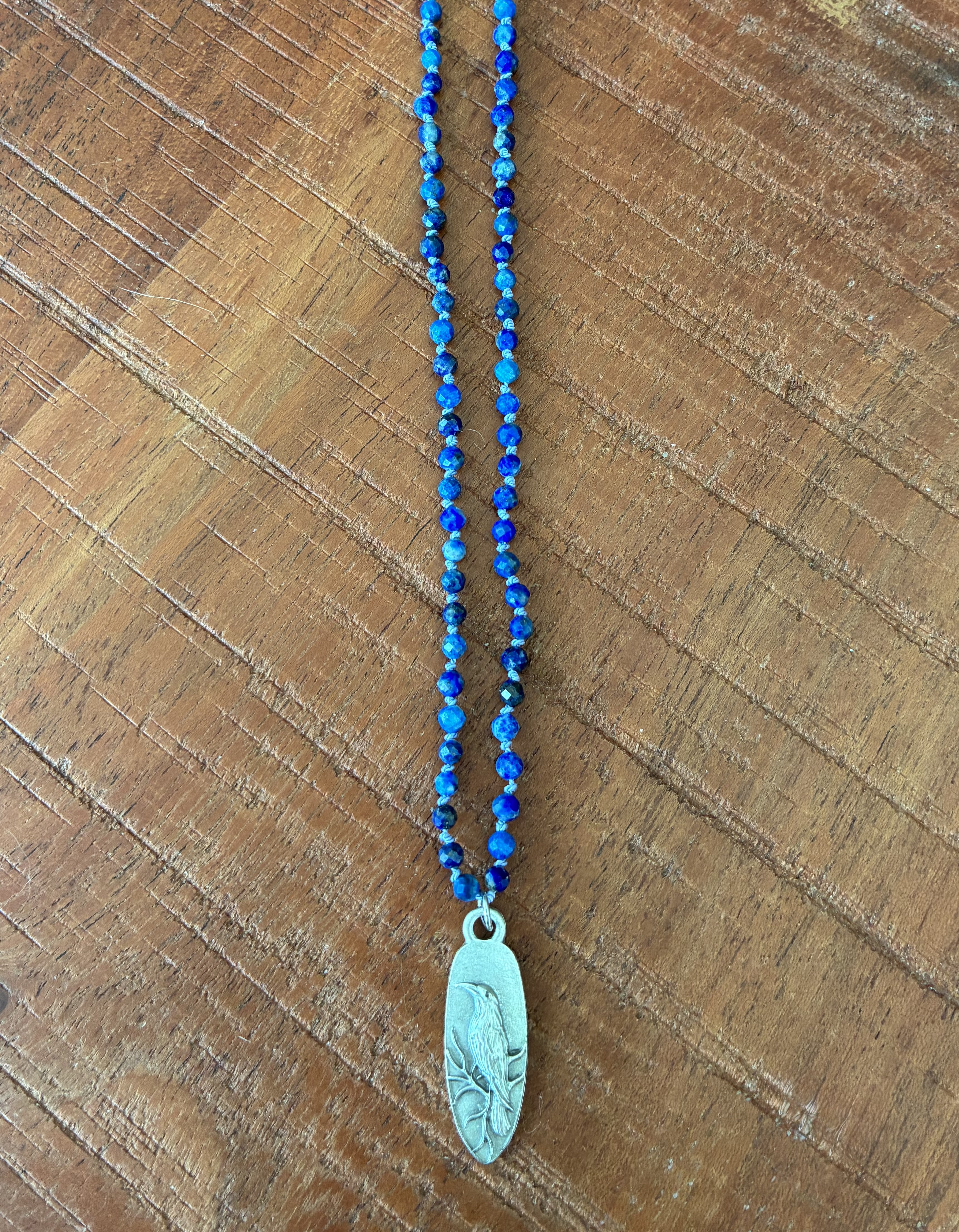 Delicate Blue Stone Necklace with Raven Pendant