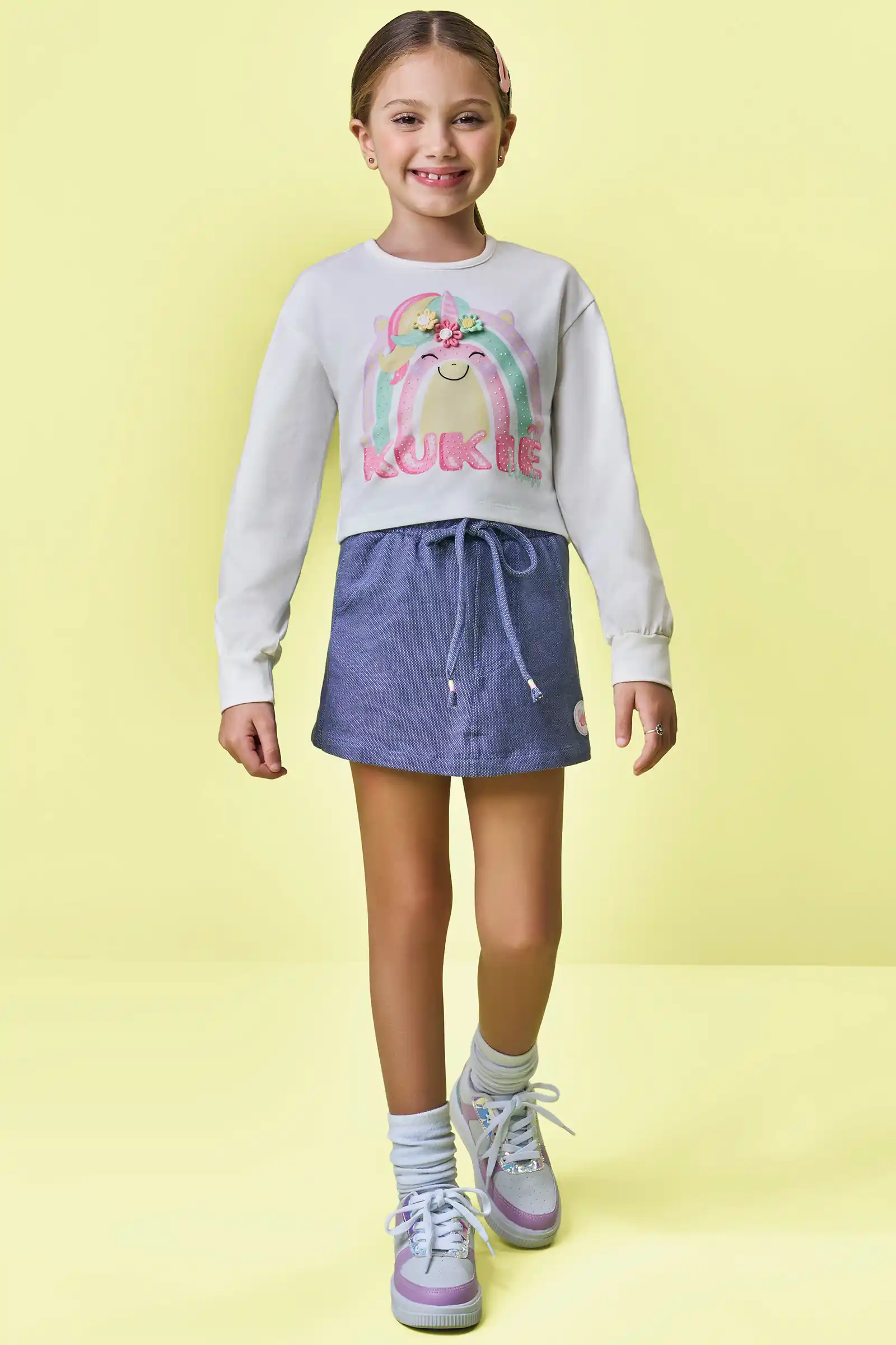 Conjunto de blusa boxy em meia malha e short saia em malha denin  