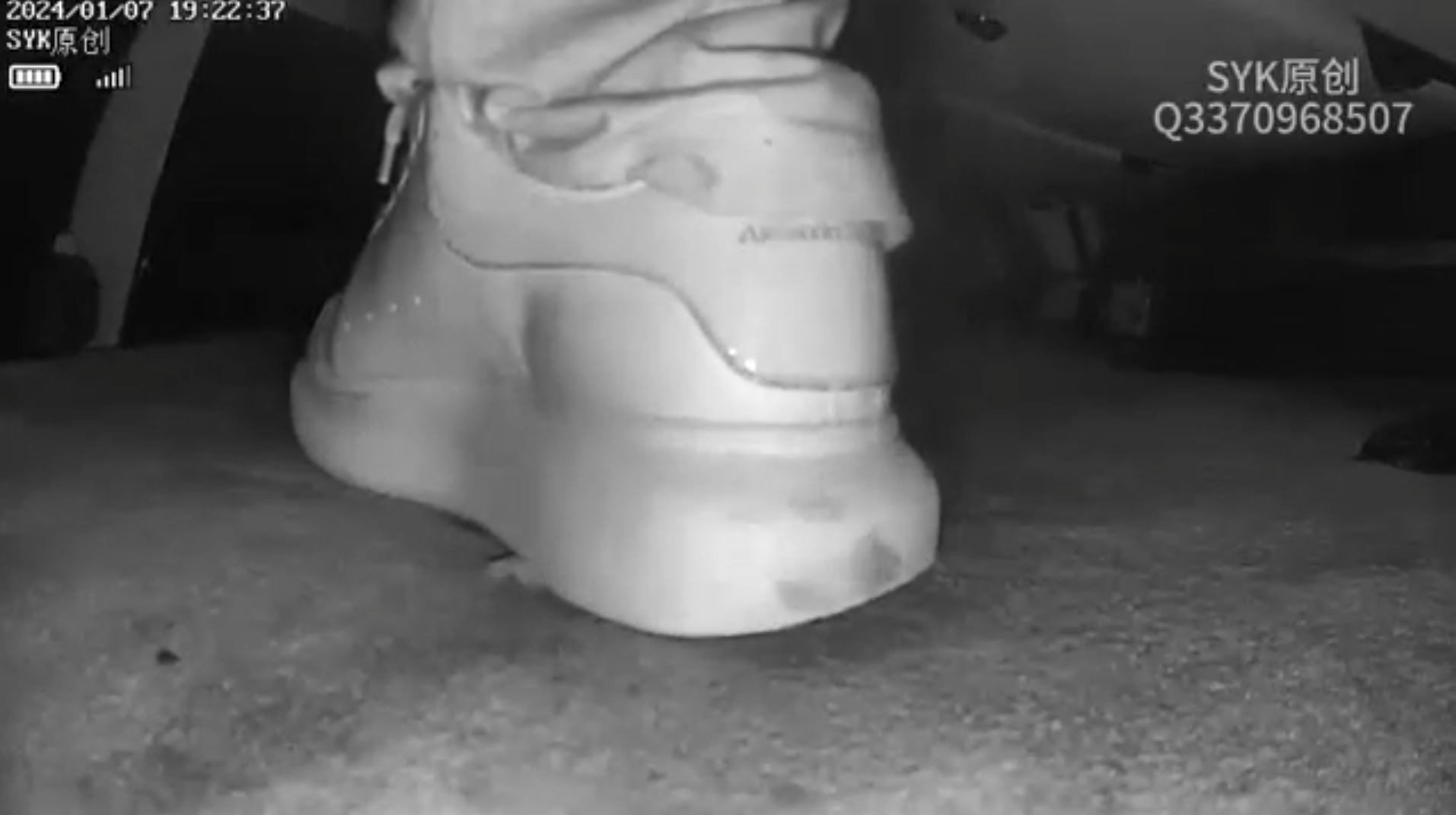 Beautiful women crush pinkie in sneakers