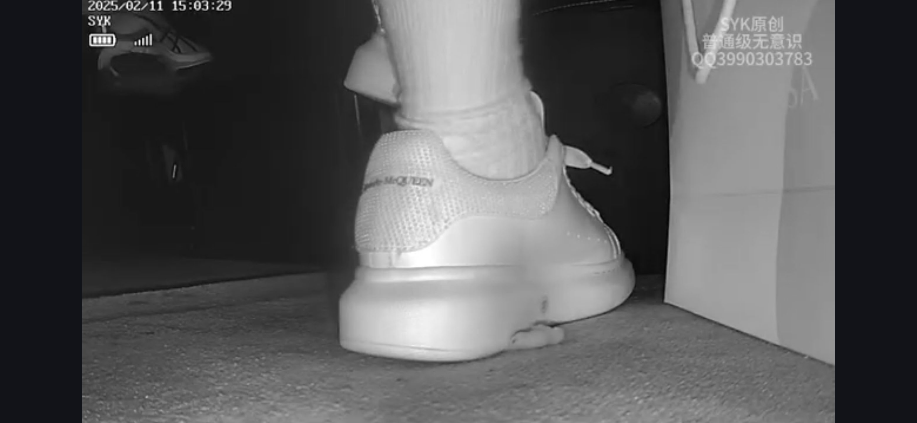 Beautiful young woman crush pinkies in Alexander Mcqueen