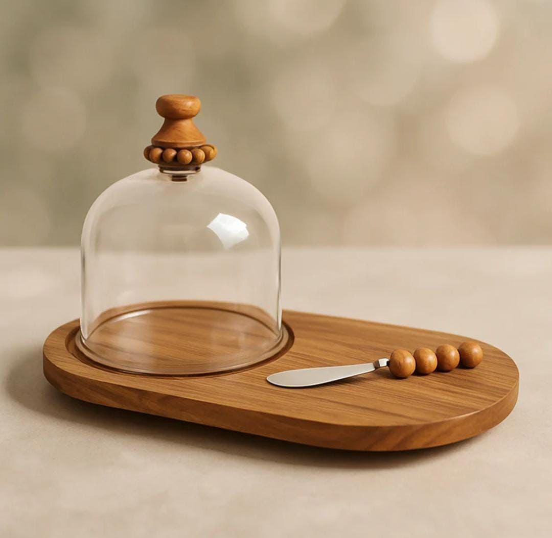 Wooden serving platter with cloche and knife