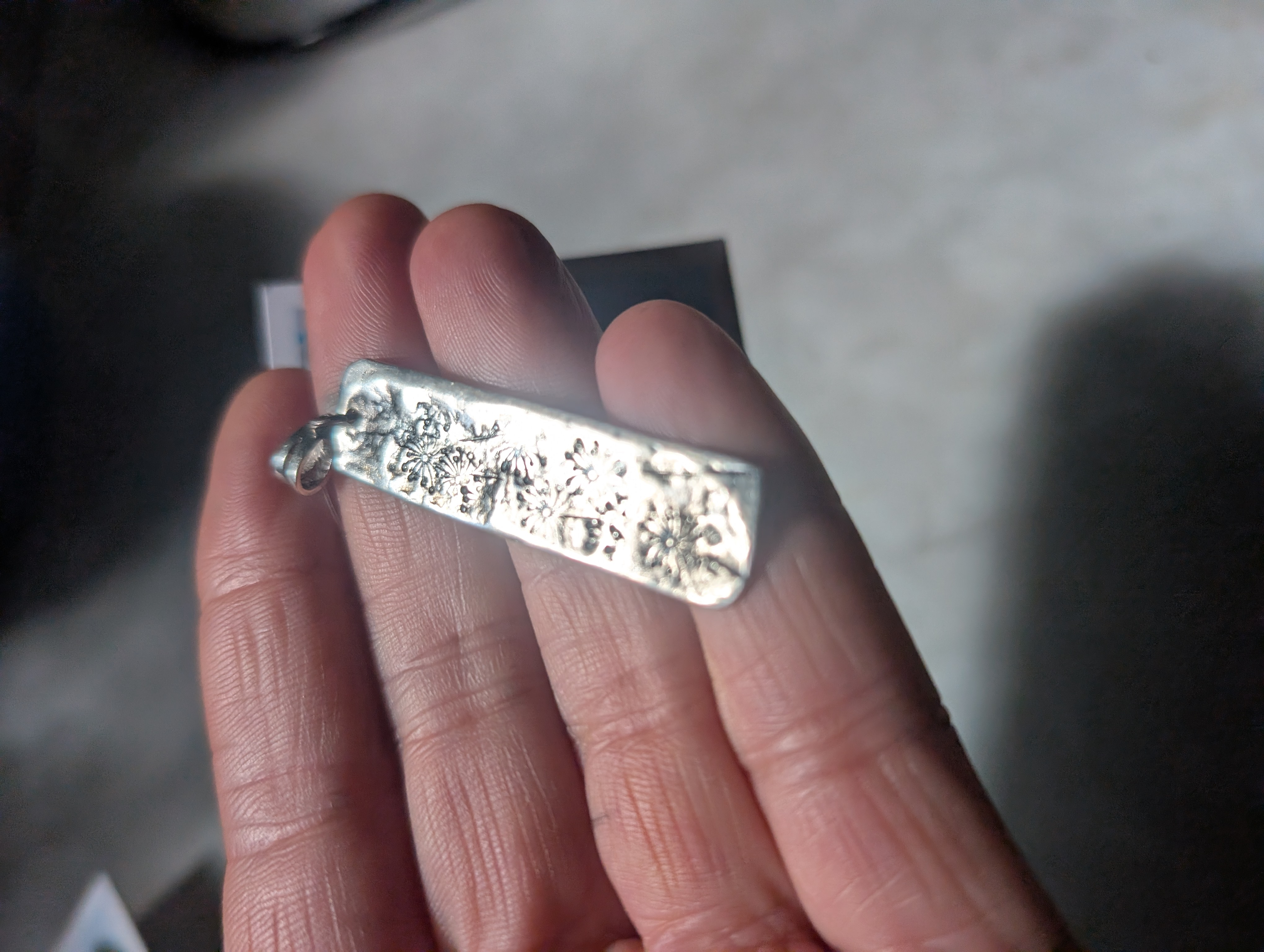 Sterling silver pendant, hand stamped design and oxidised.