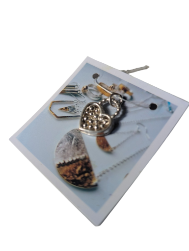 Sterling silver pendant, heart shaped with detail.