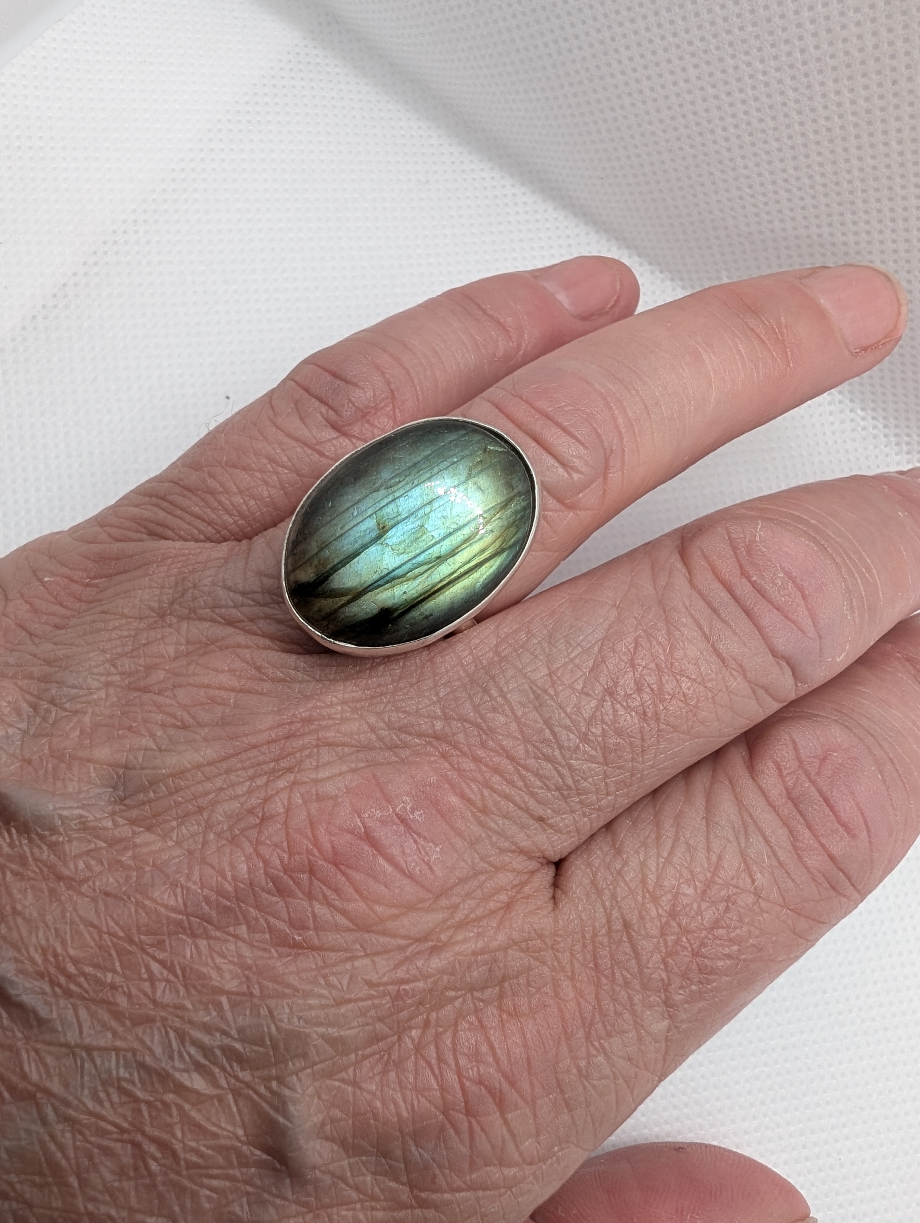 Large labradorite cabochon, set in sterling silver. Size M