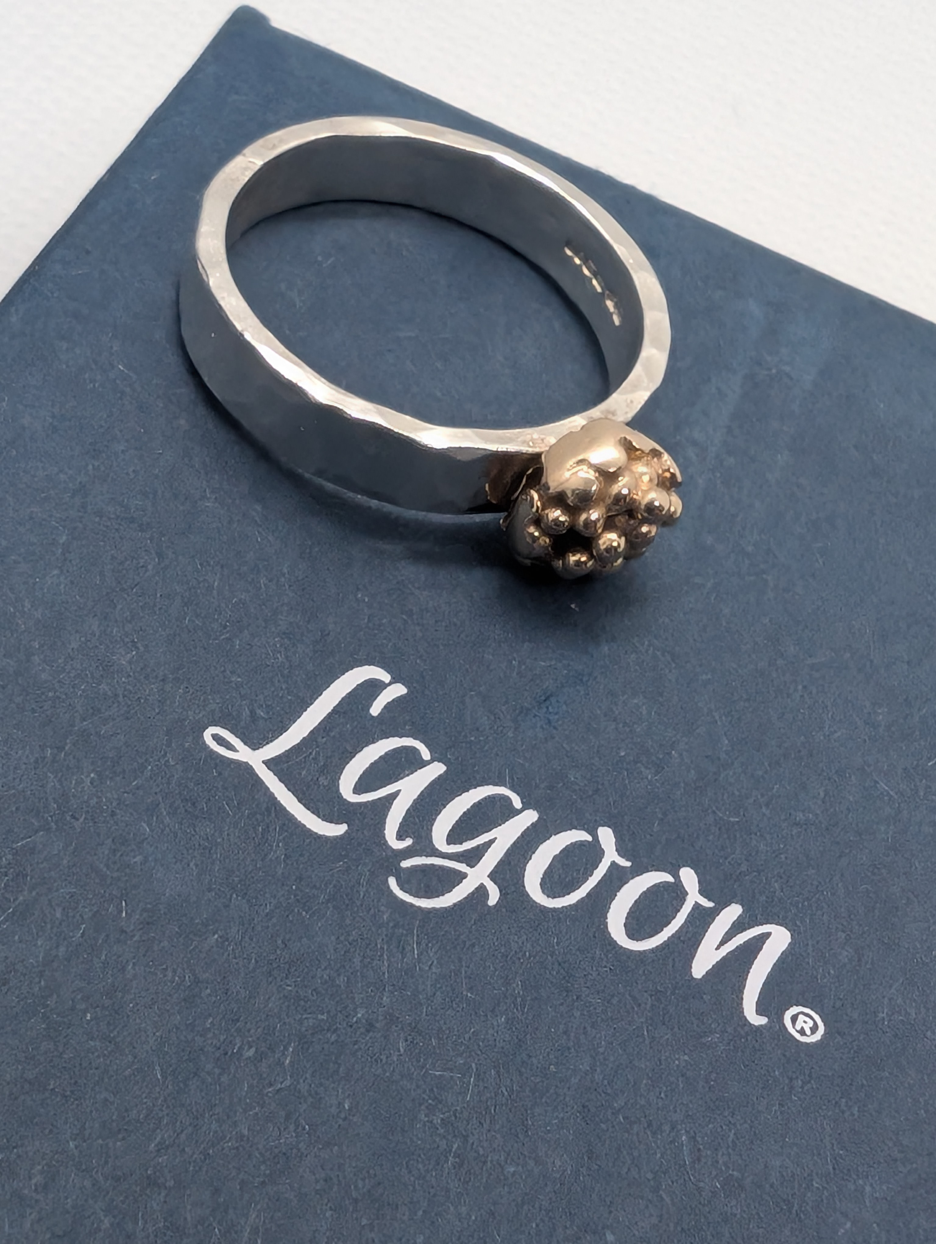 Sterling silver ring with 9ct gold accent. Hammered finish using recycled silver and gold, Size M