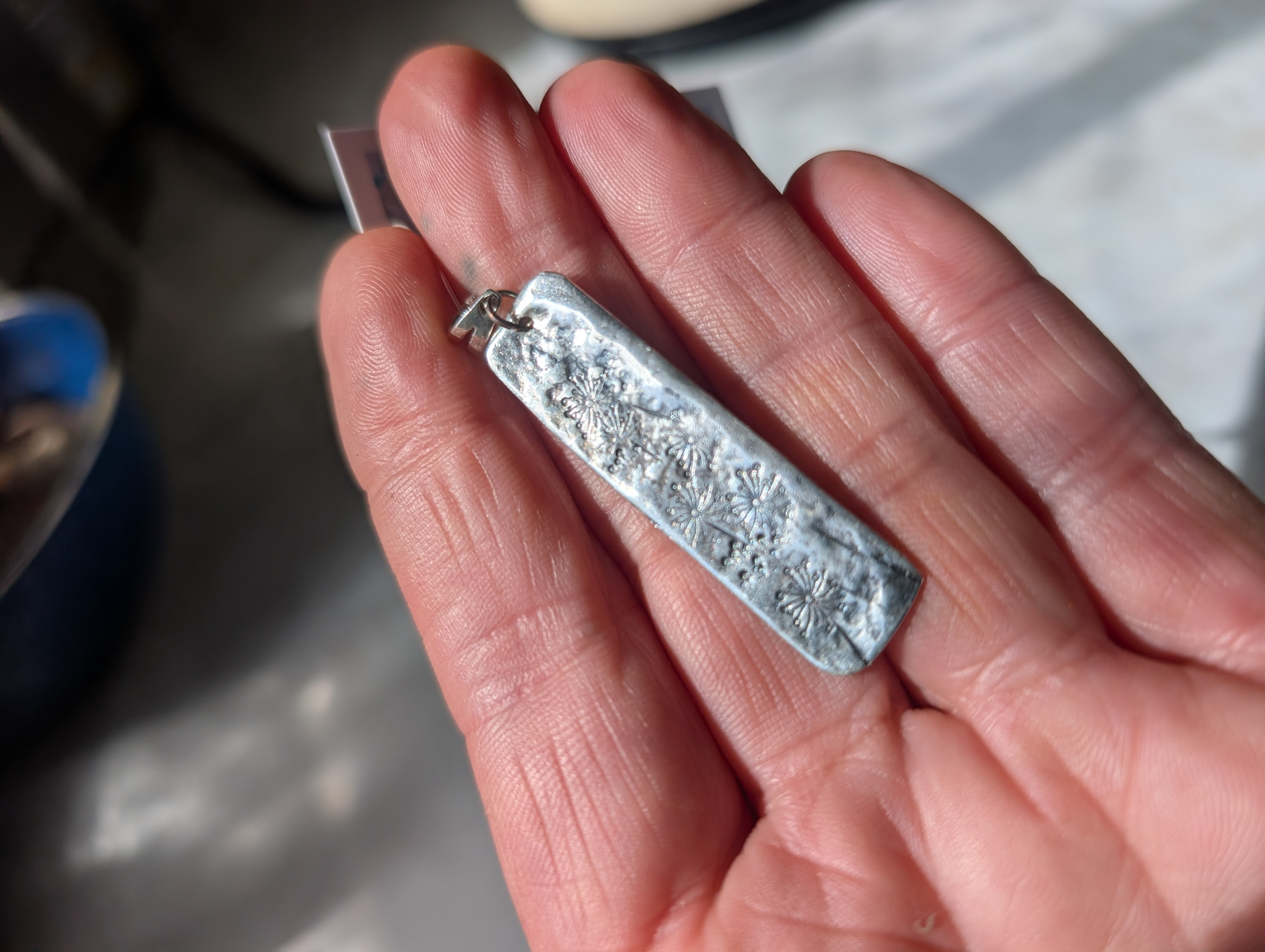 Sterling silver pendant, hand stamped design and oxidised.