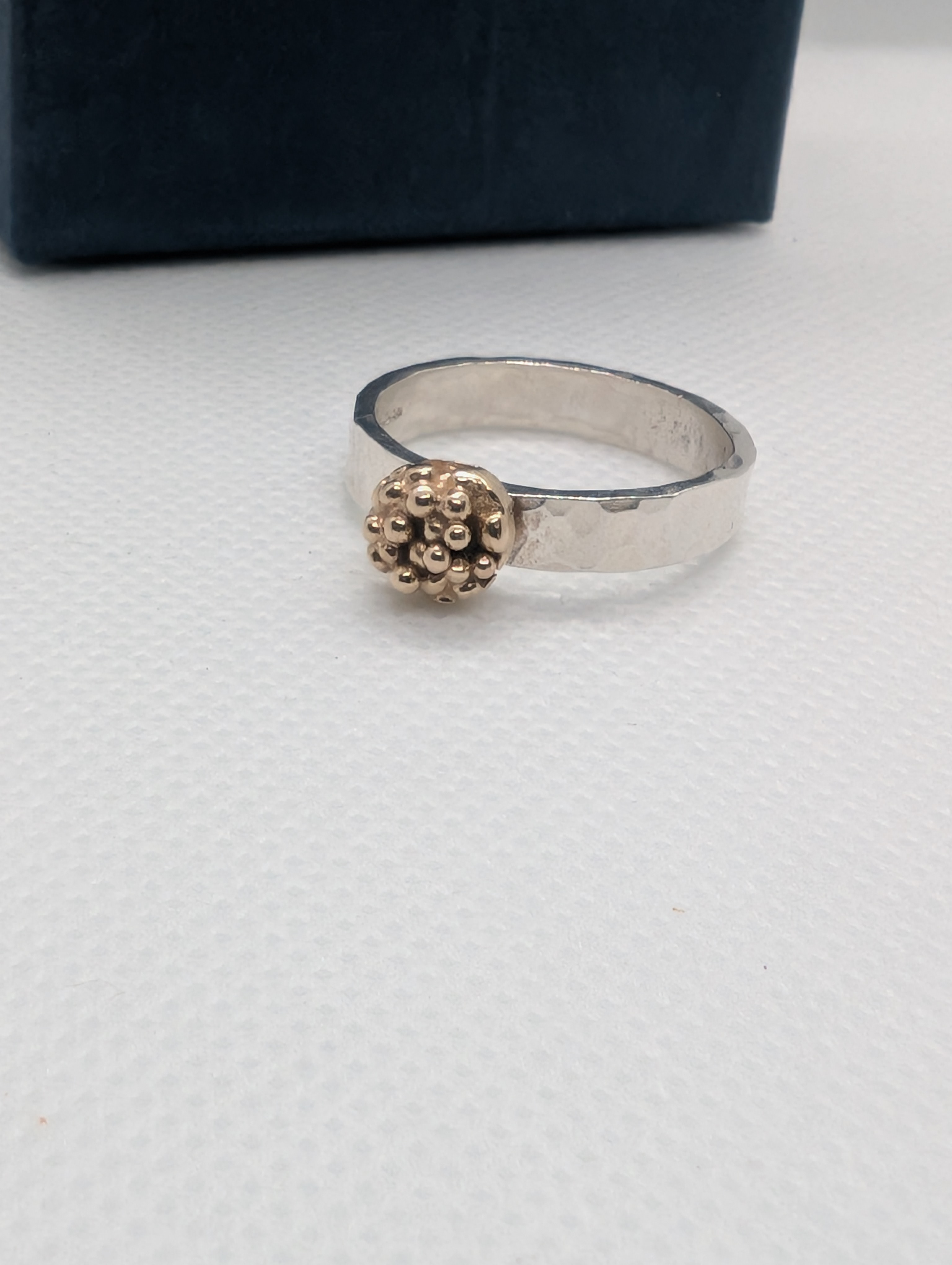 Sterling silver ring with 9ct gold accent. Hammered finish using recycled silver and gold, Size M