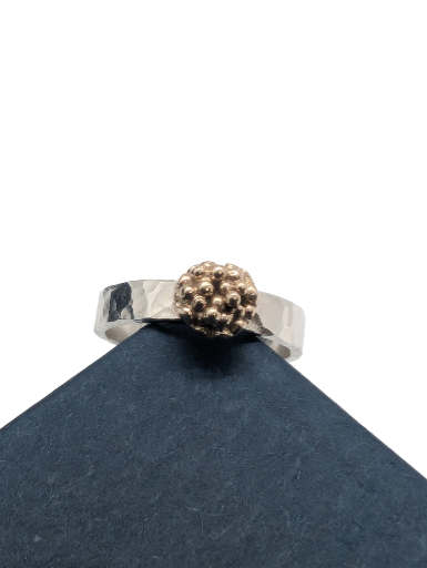 Sterling silver ring with 9ct gold accent. Hammered finish using recycled silver and gold, Size M