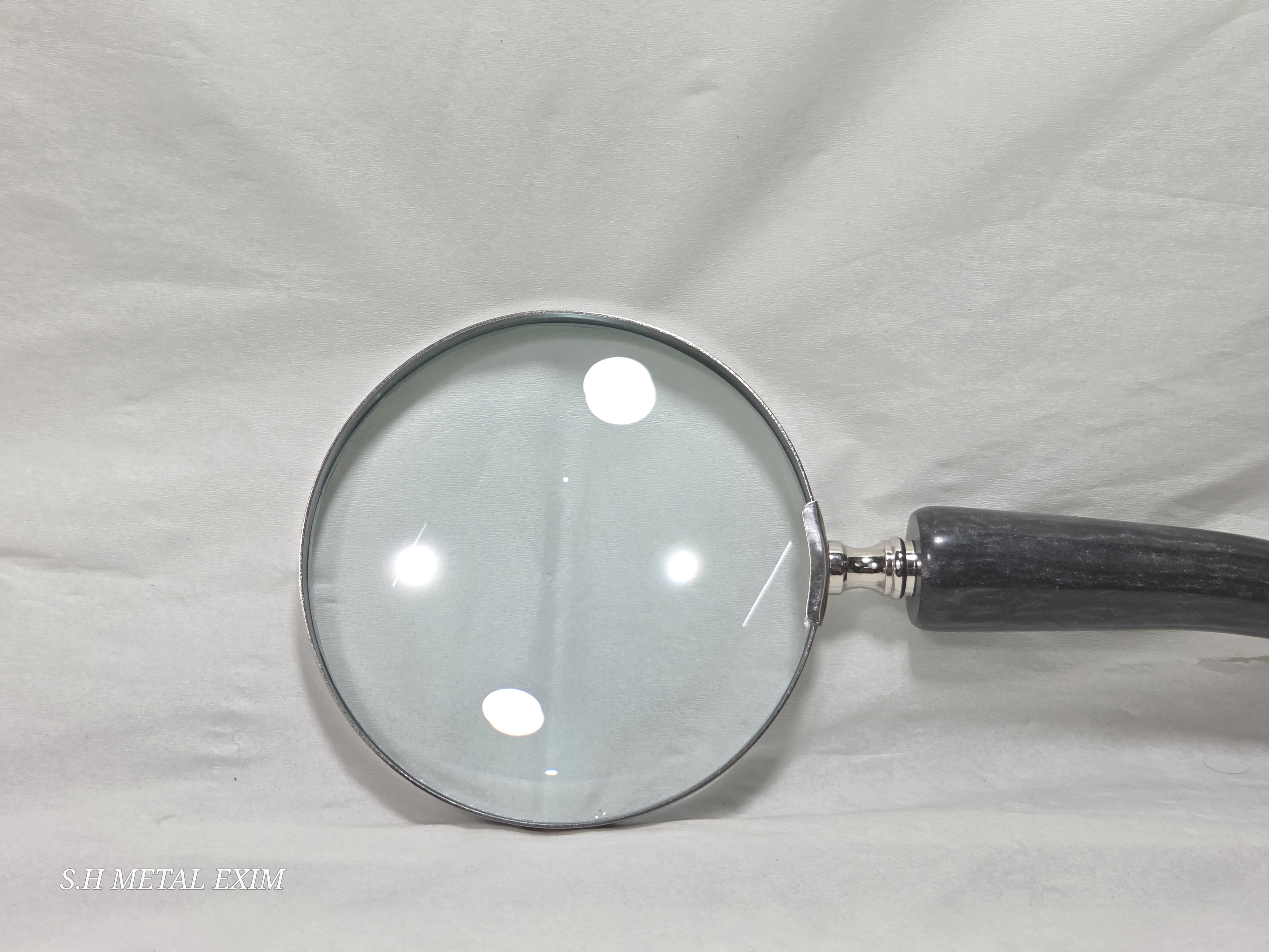 The Seeker’s slim horn magnifying glass.