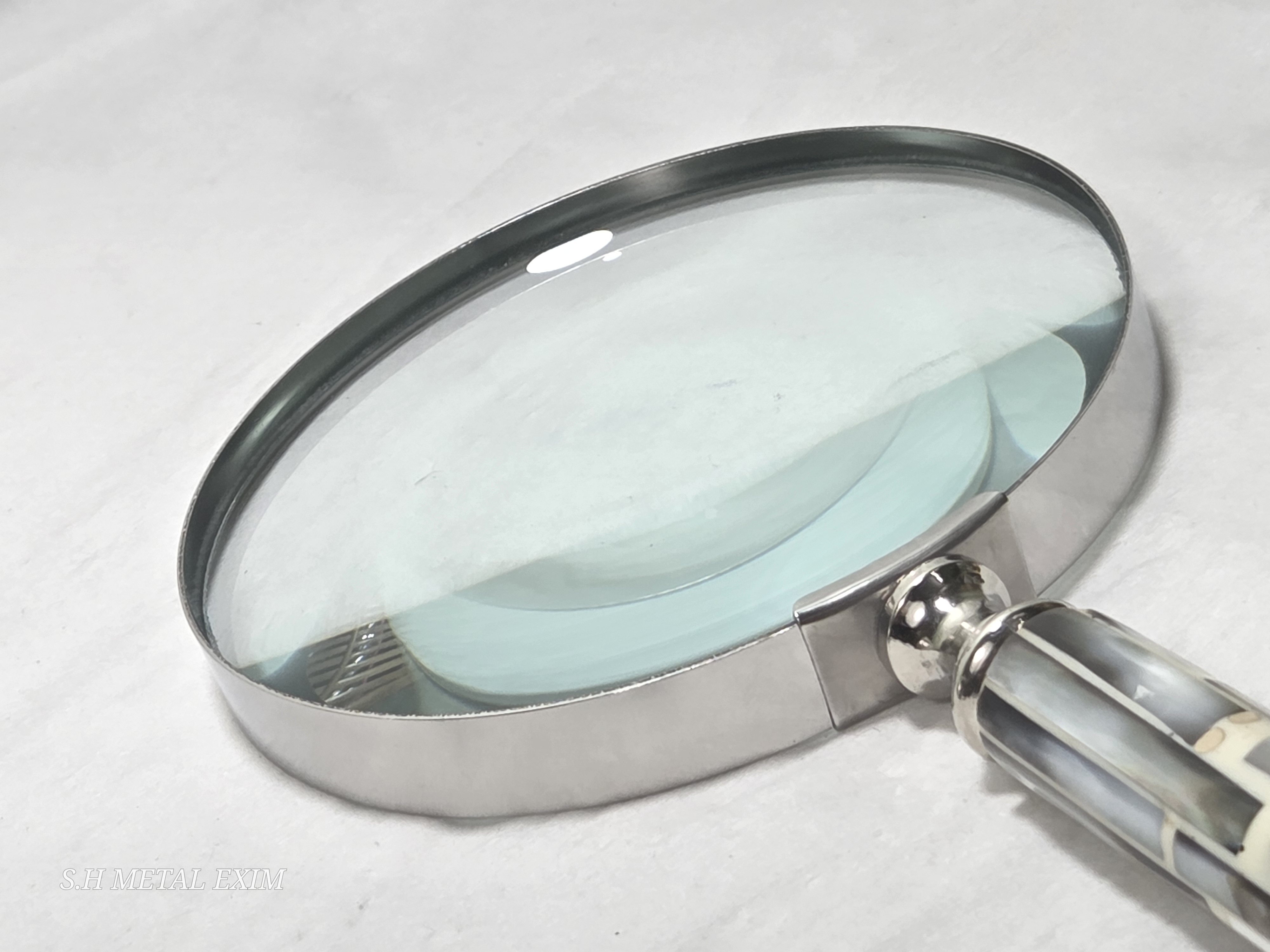 A curated collection of vintage curiosities magnifying glass.