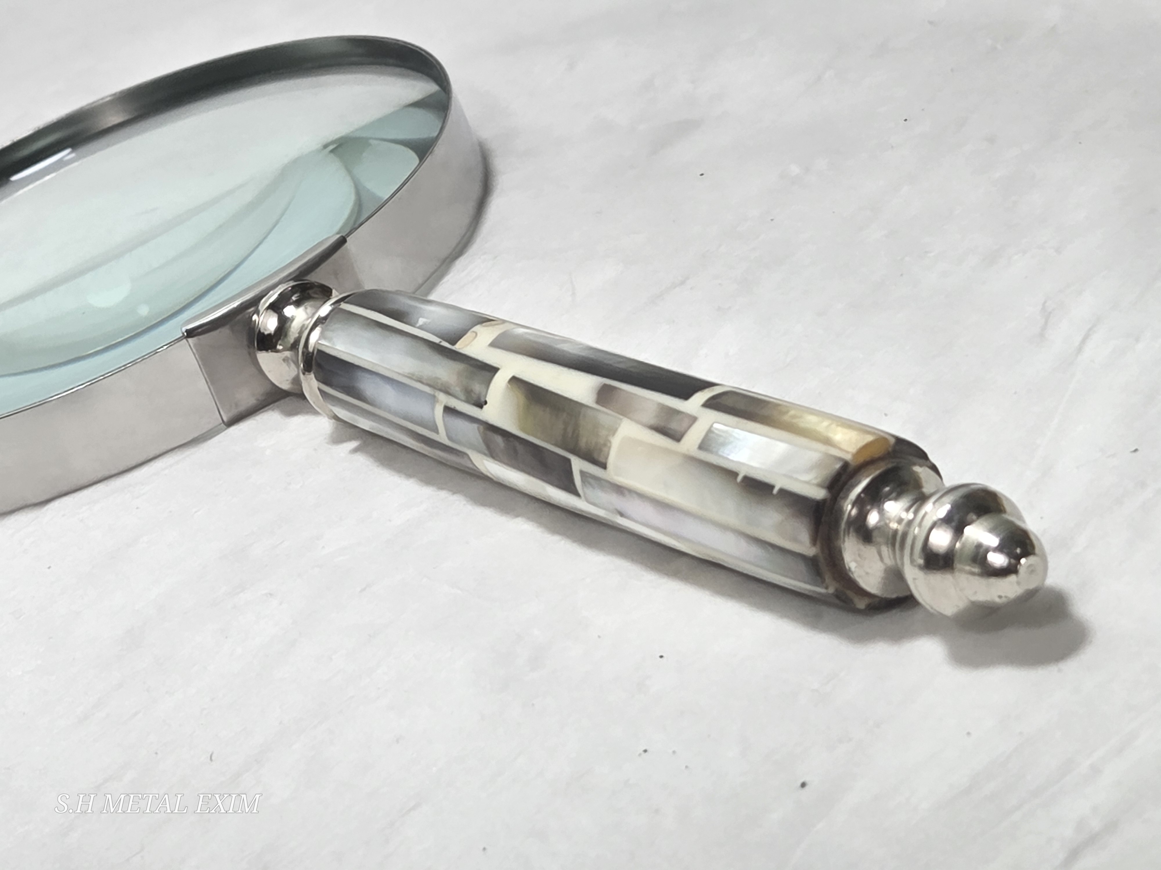 A curated collection of vintage curiosities magnifying glass.