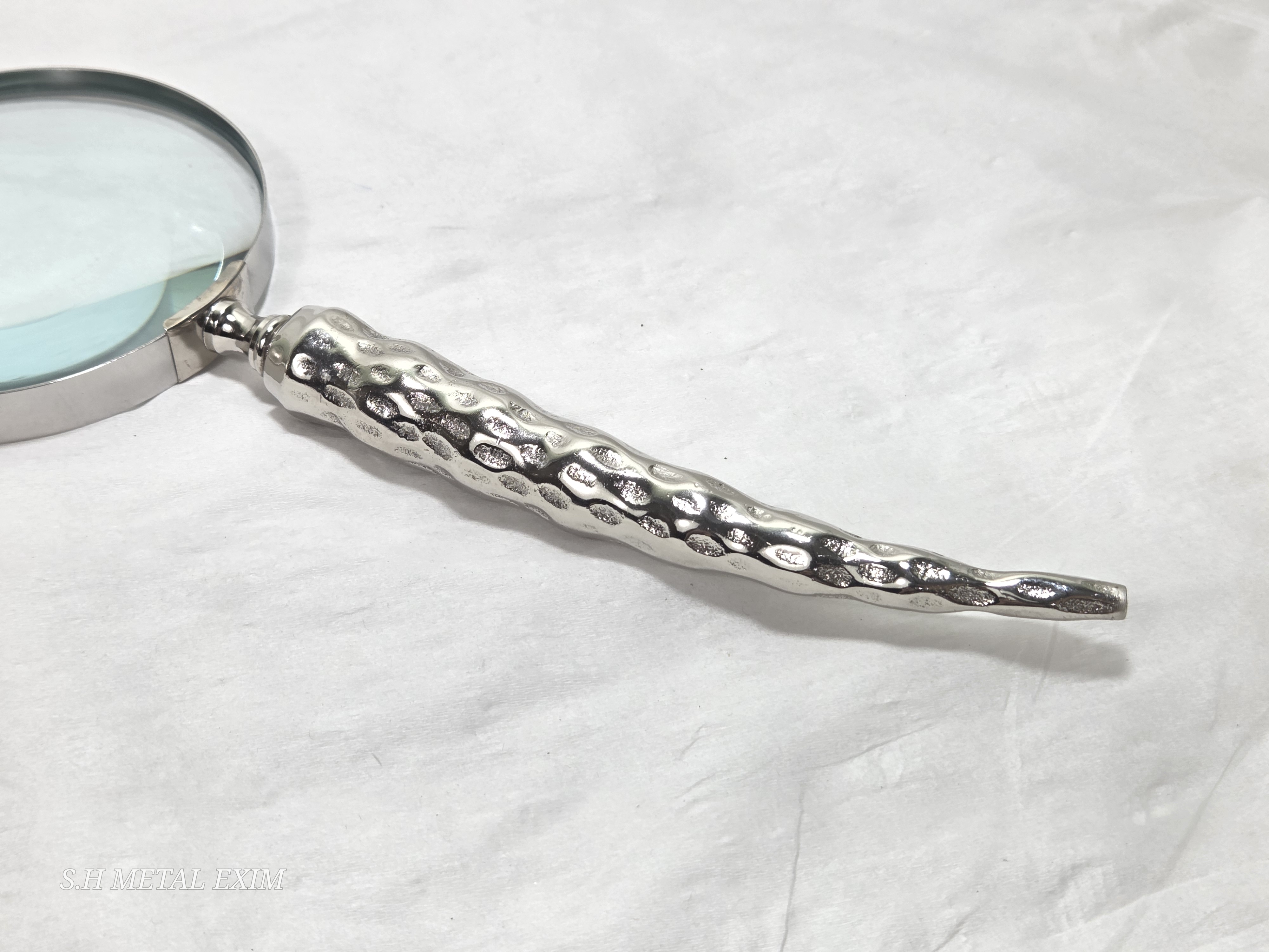Detailed slim metal magnifying glass 
