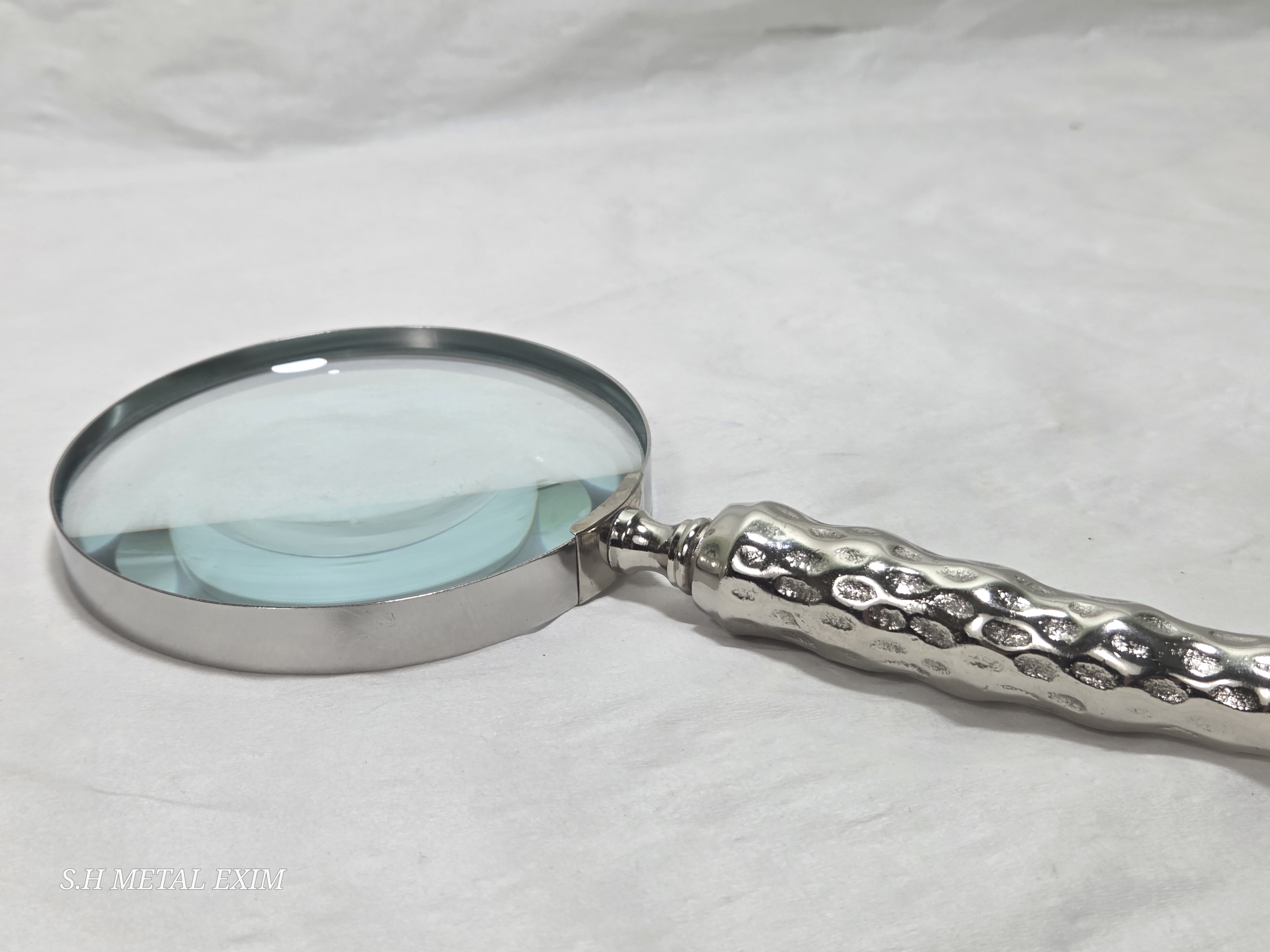 Detailed slim metal magnifying glass 