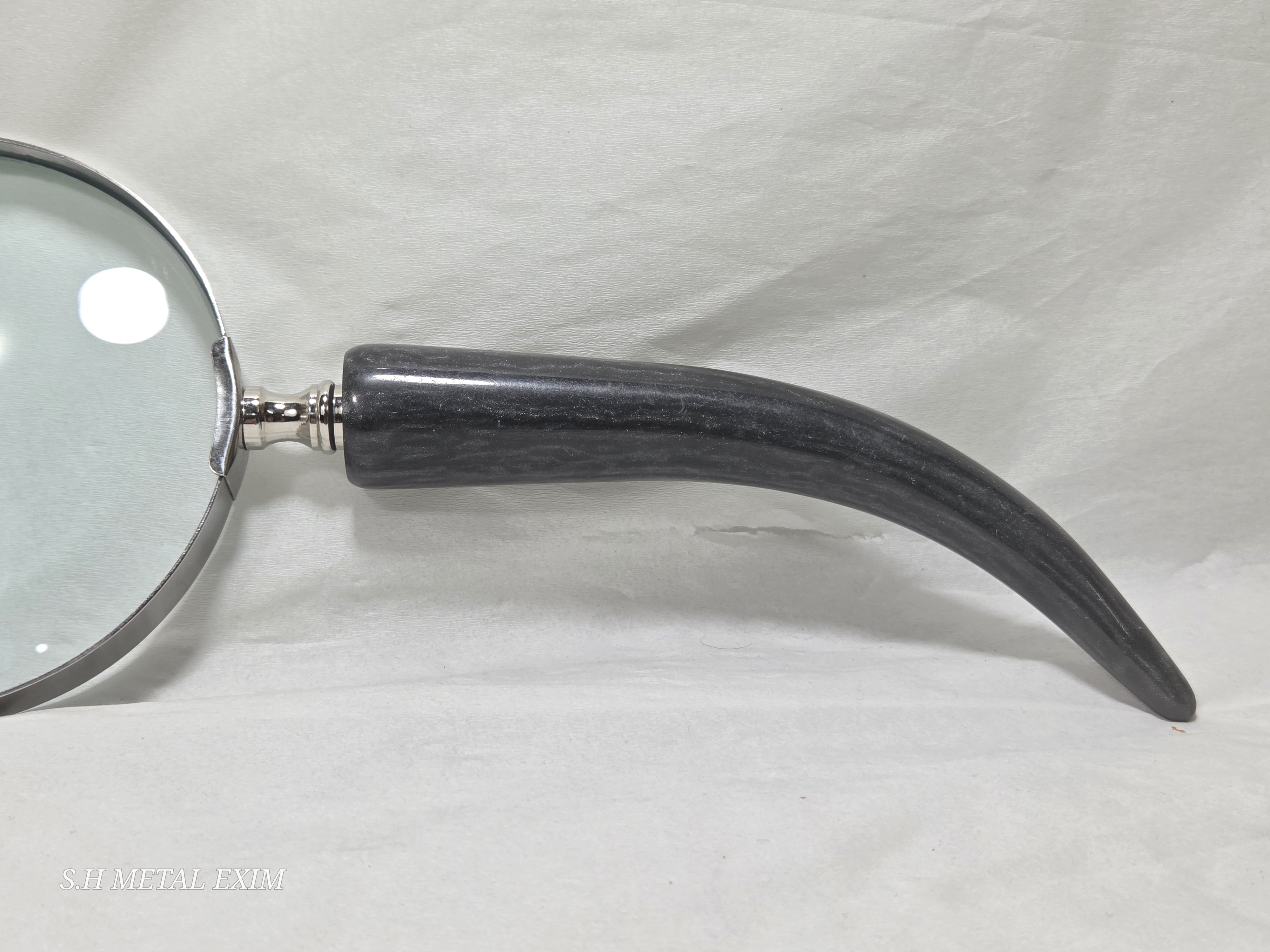 The Seeker’s slim horn magnifying glass.