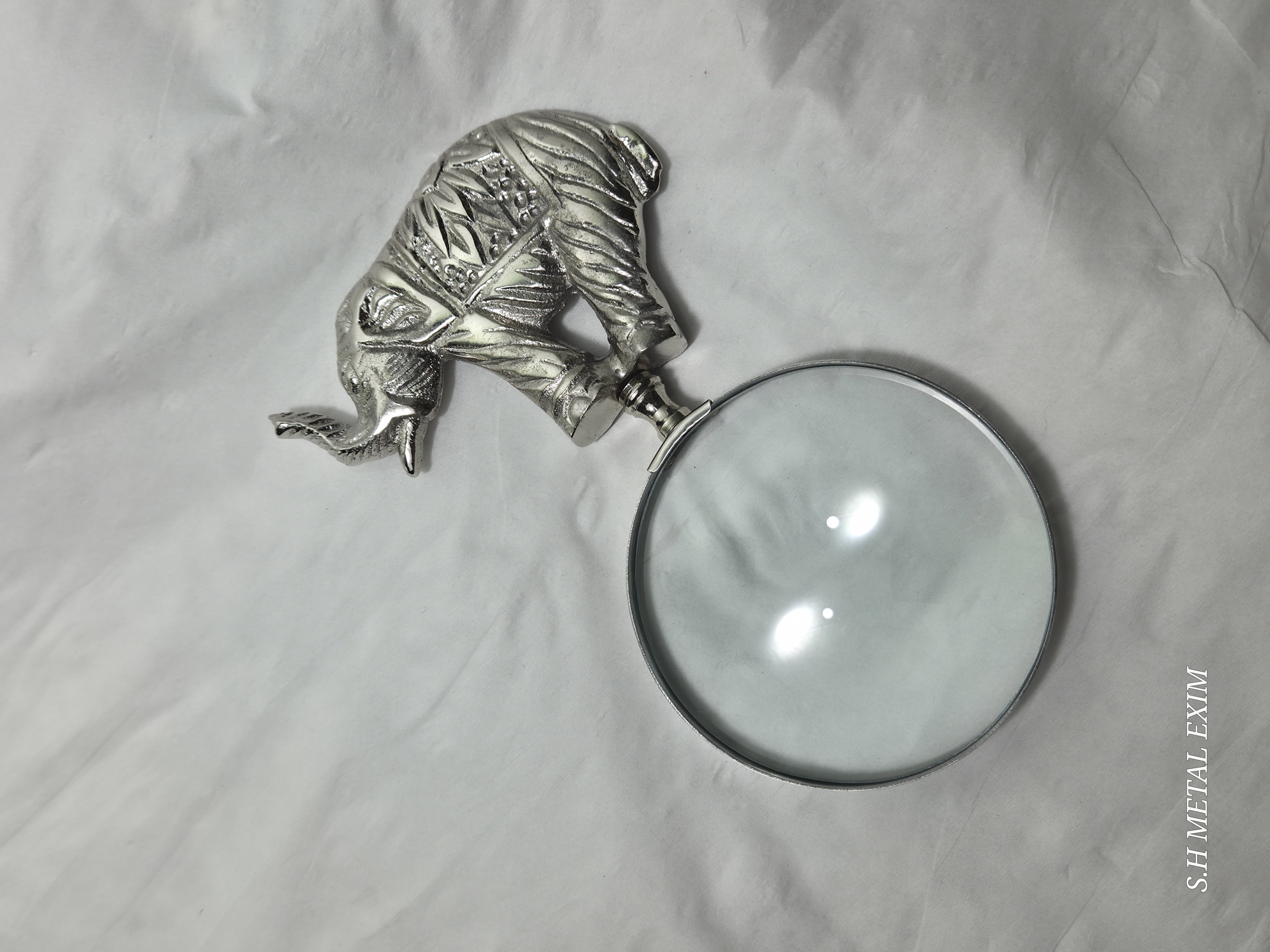 Navigating Legend: The Scholar’s Gilded Atlas and Elephant Magnifier