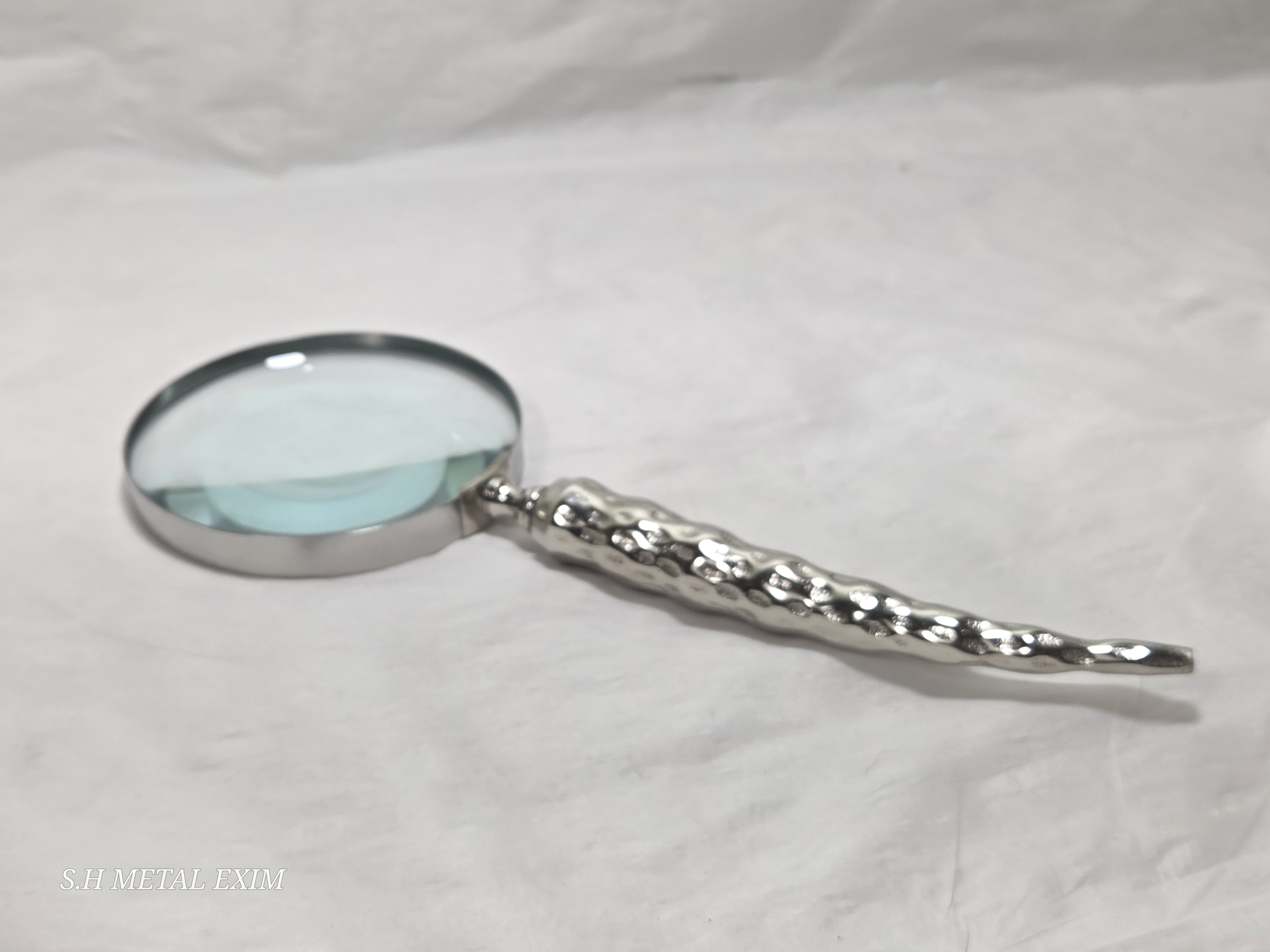 Detailed slim metal magnifying glass 