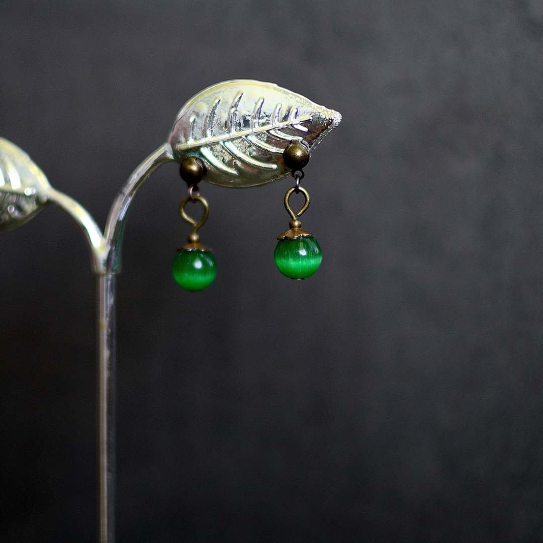 Green cats eye dangle earrings