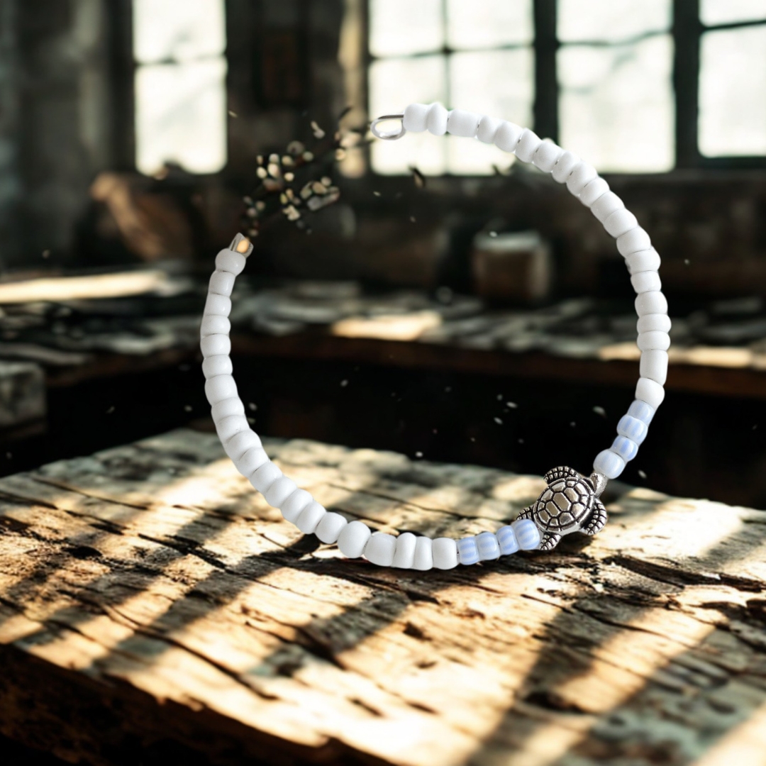 Bracelet with Turtle charm and pastel blue and white beads - beach themed