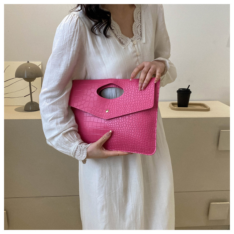 Cartera de mano fucsia