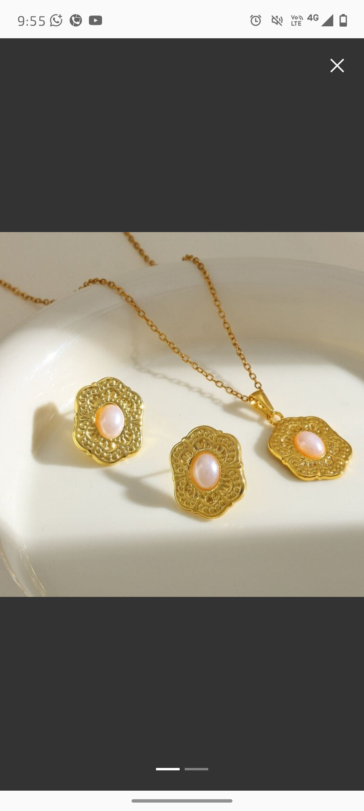 Set de joyería dorada con perla