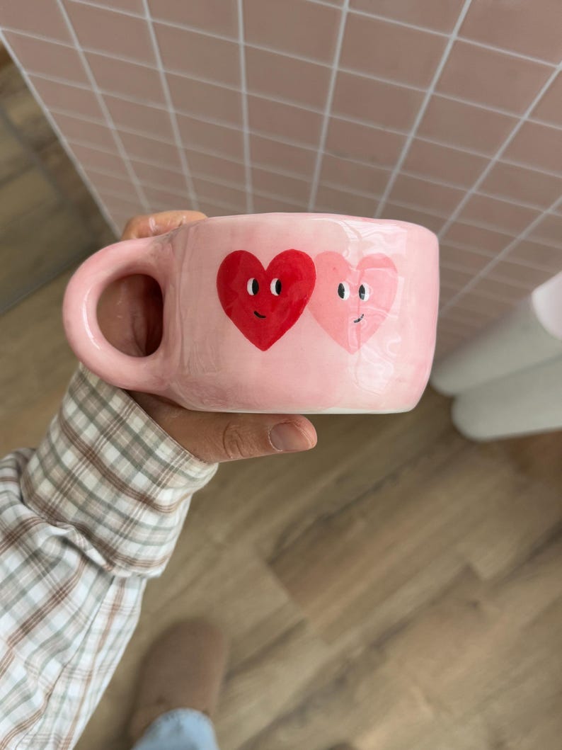 Handmade Baby Pink Ceramic Mug: Two Hearts Side Eye Pottery Cup